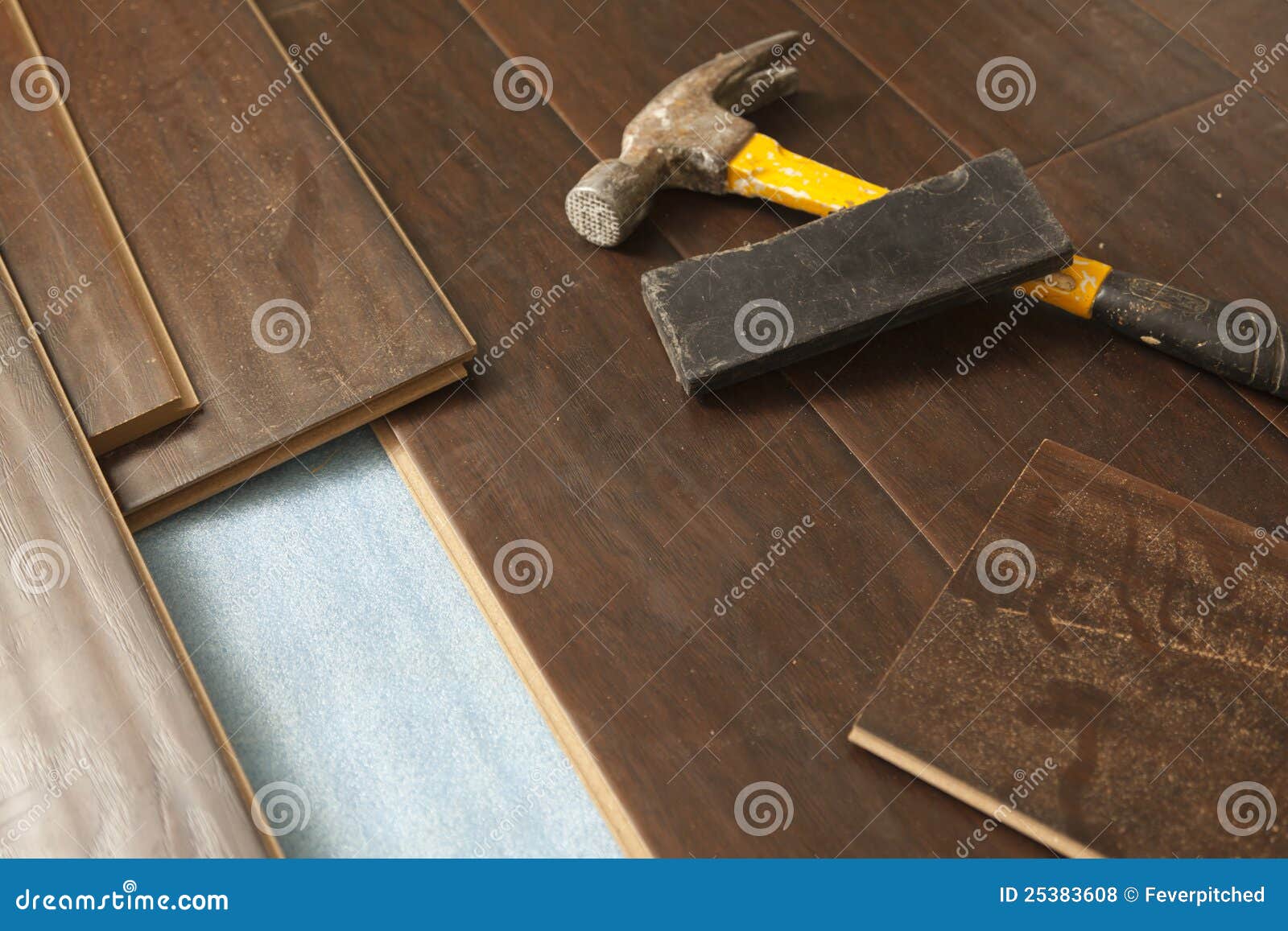 Hammer and Block with New Laminate Flooring Stock Photo Image of