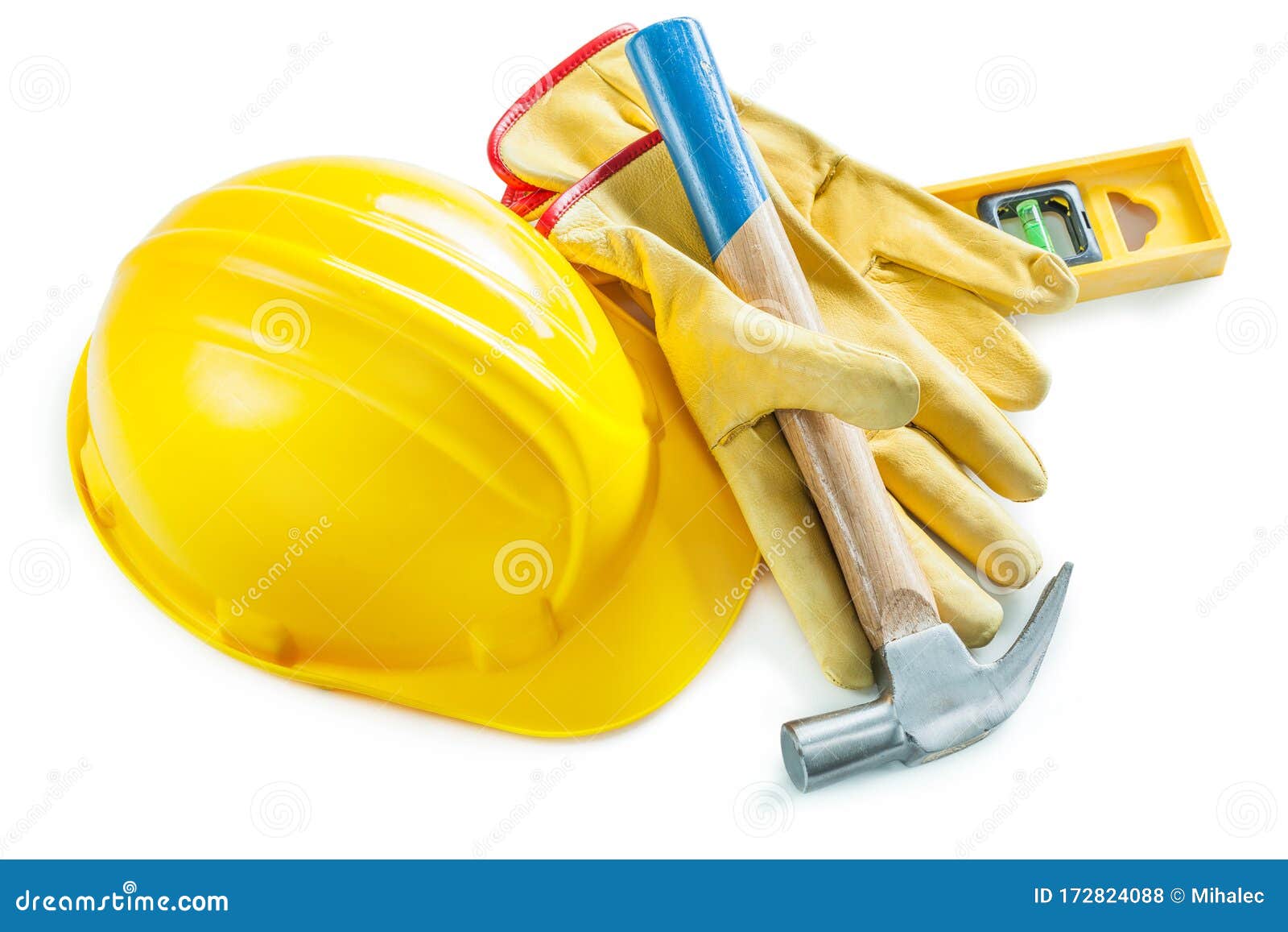 hammer in gloves helmet and construction lvel 