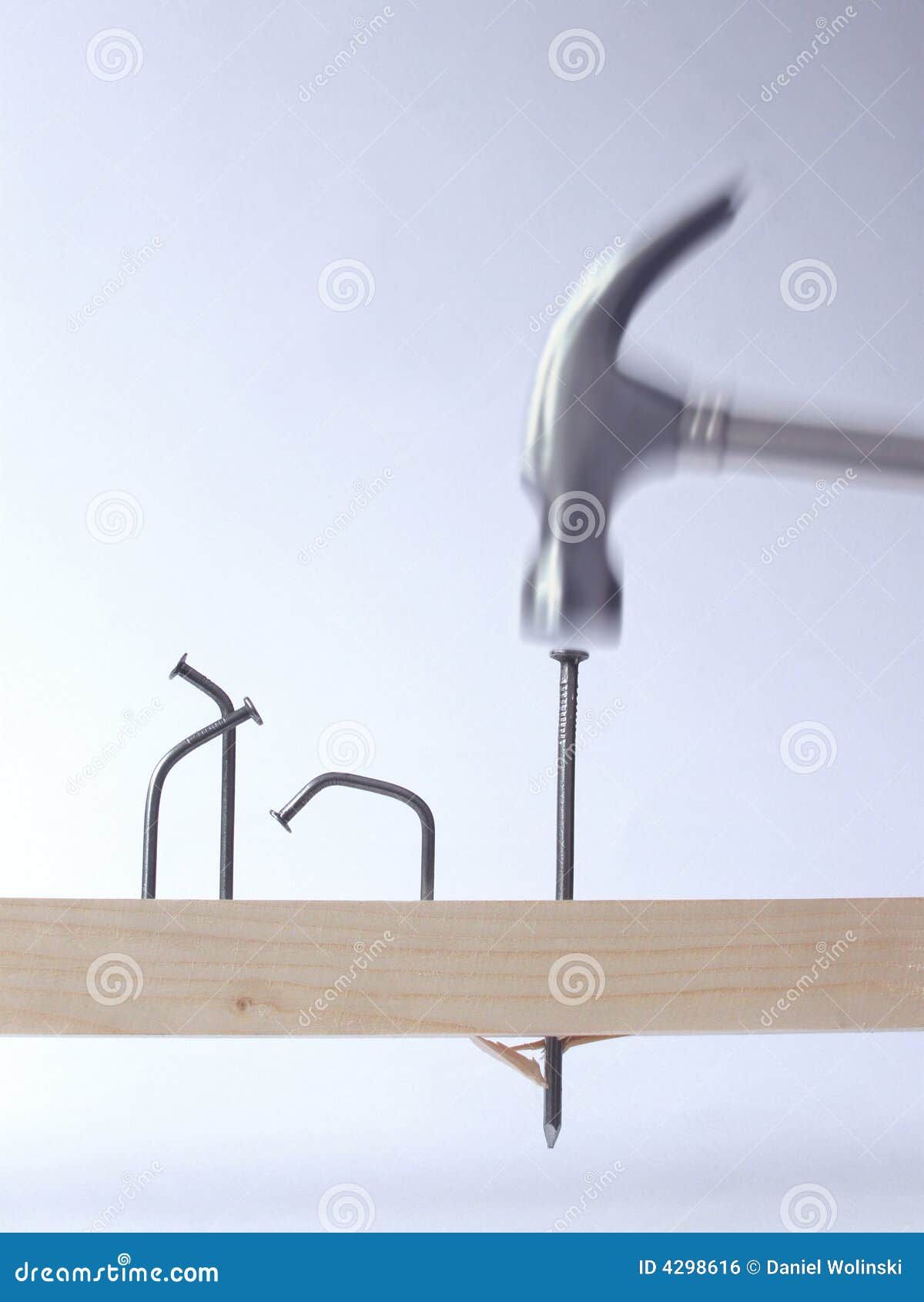 A man picking up a hammer with nails and screws on home improvement  construction site Stock Photo | Adobe Stock