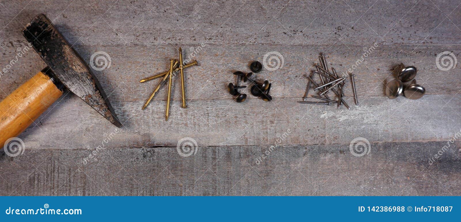 hammer and nails on natural wooden background with copy space for your own text