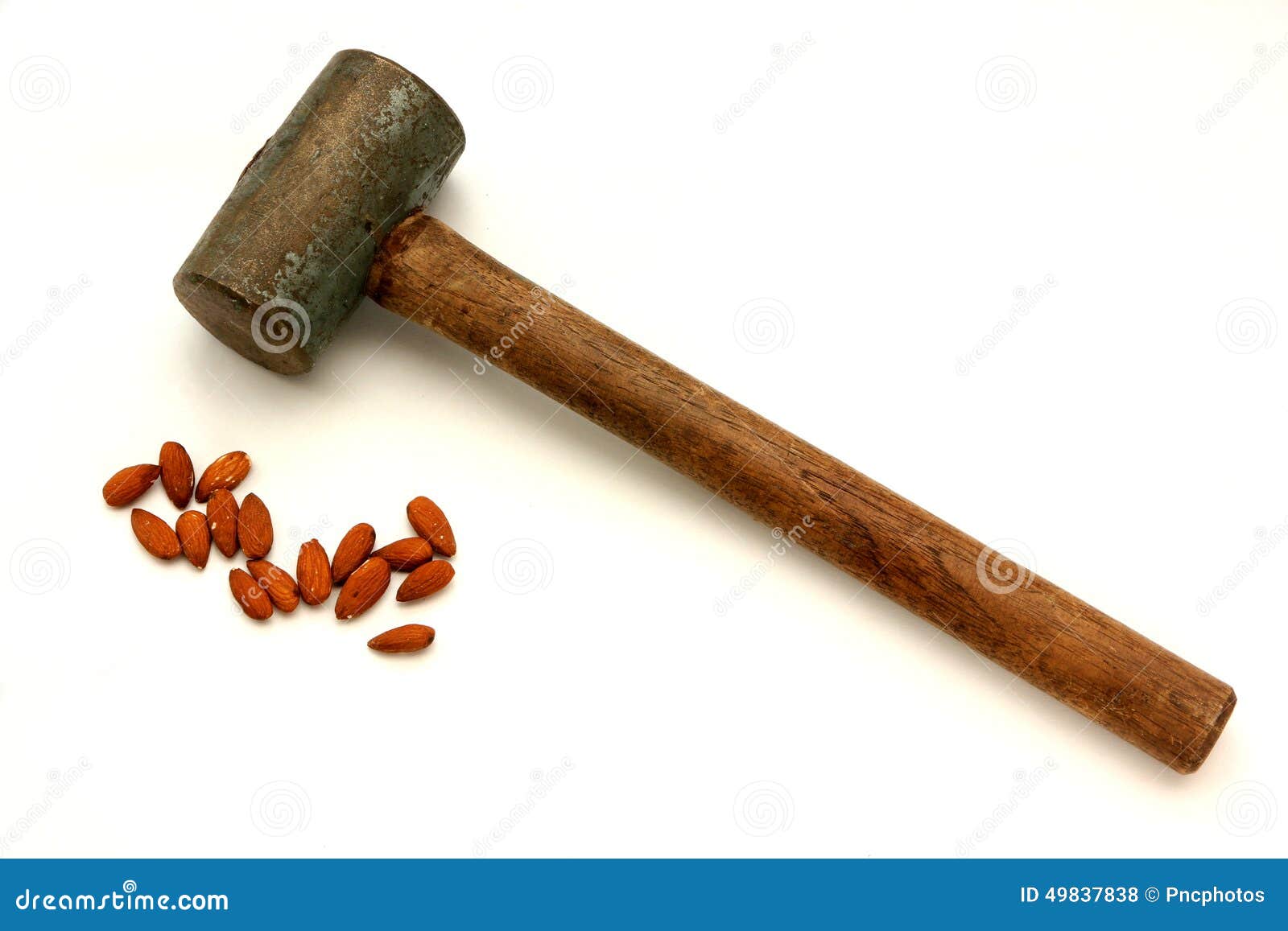 Hammer to crack a nut stock photo. Image of power, force 49837838
