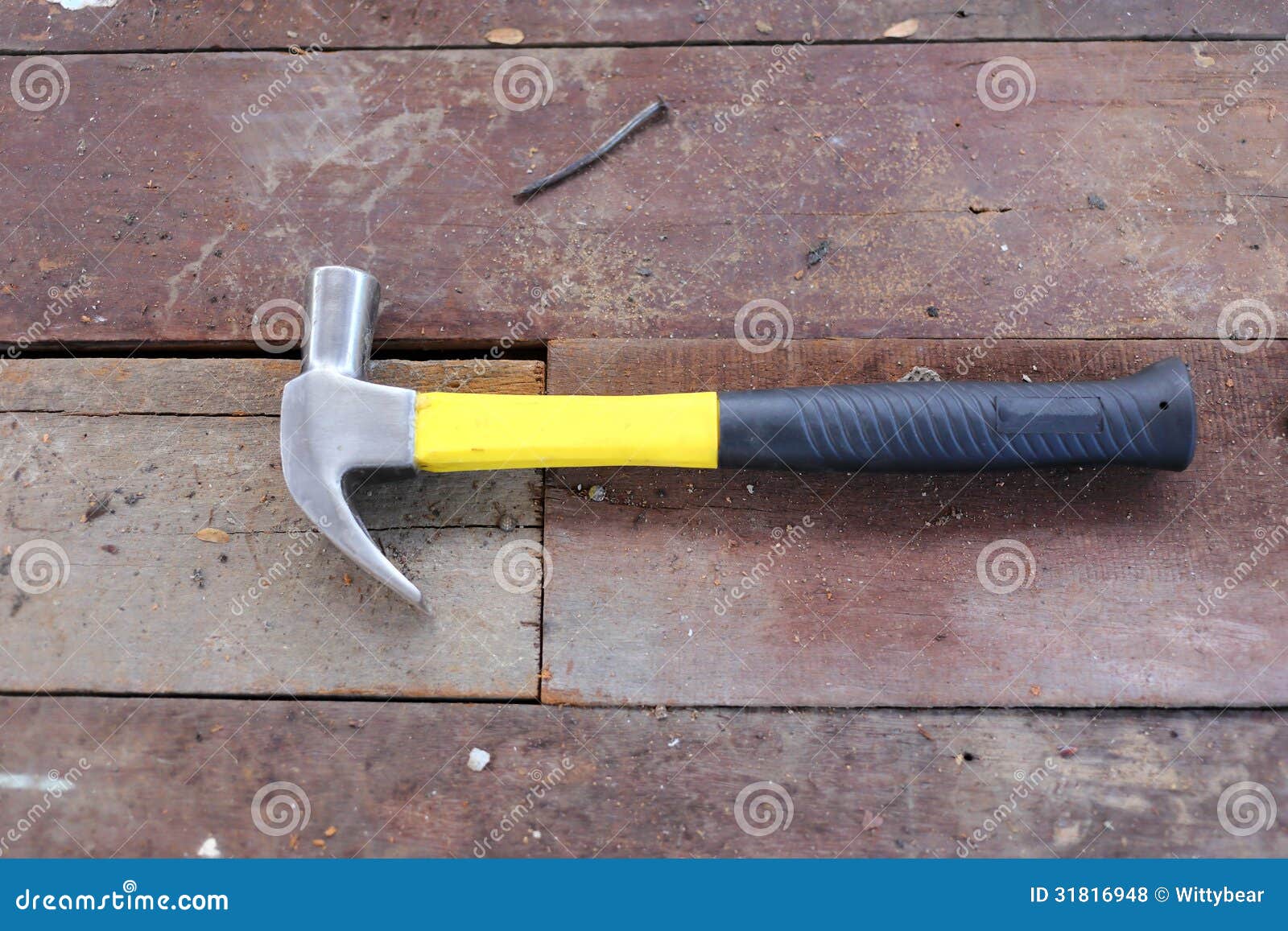 A hammer on wooden floor stock photo. Image of carpentry 31816948