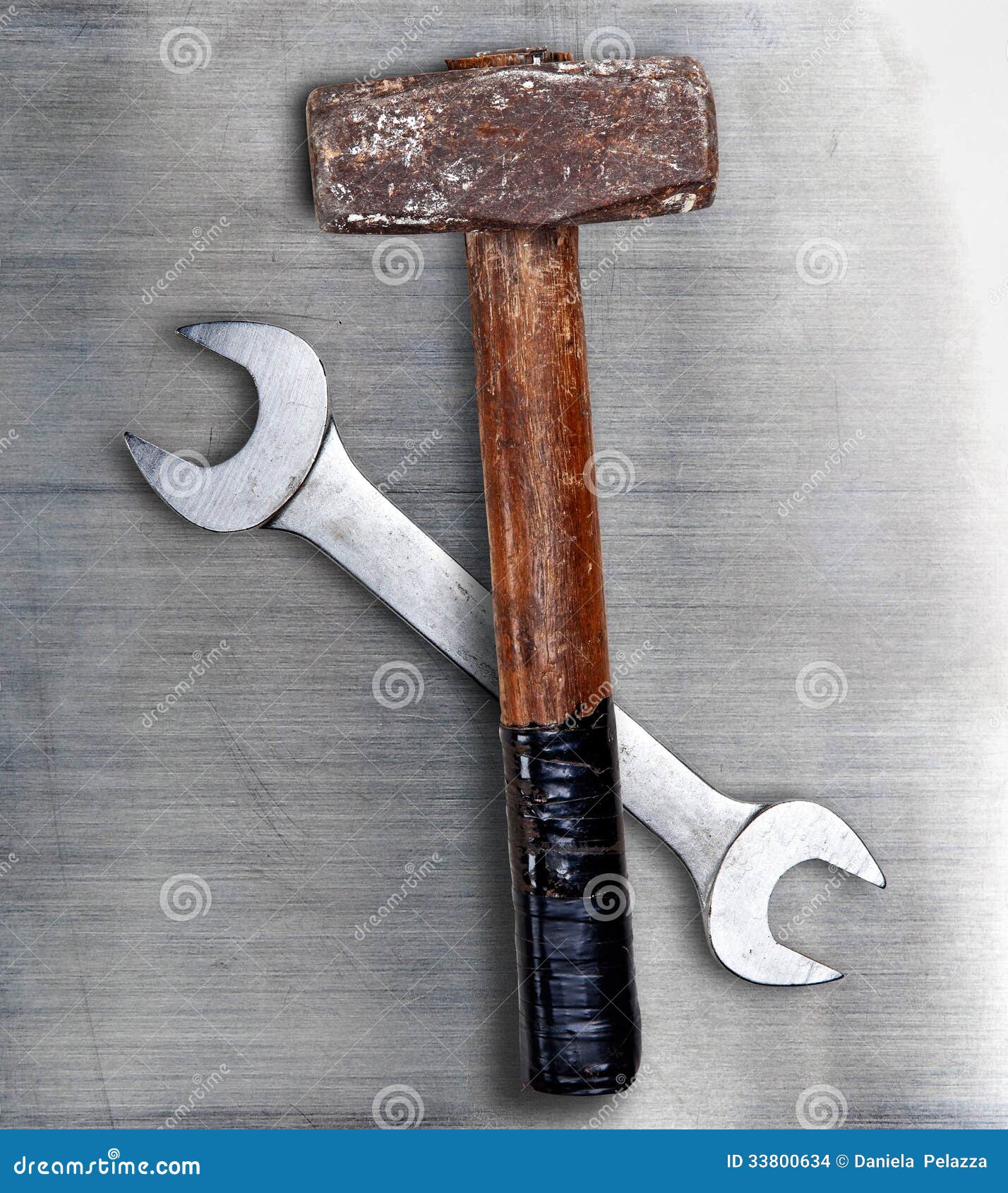 Hammer and wrench on metal stock photo. Image of isolated 33800634