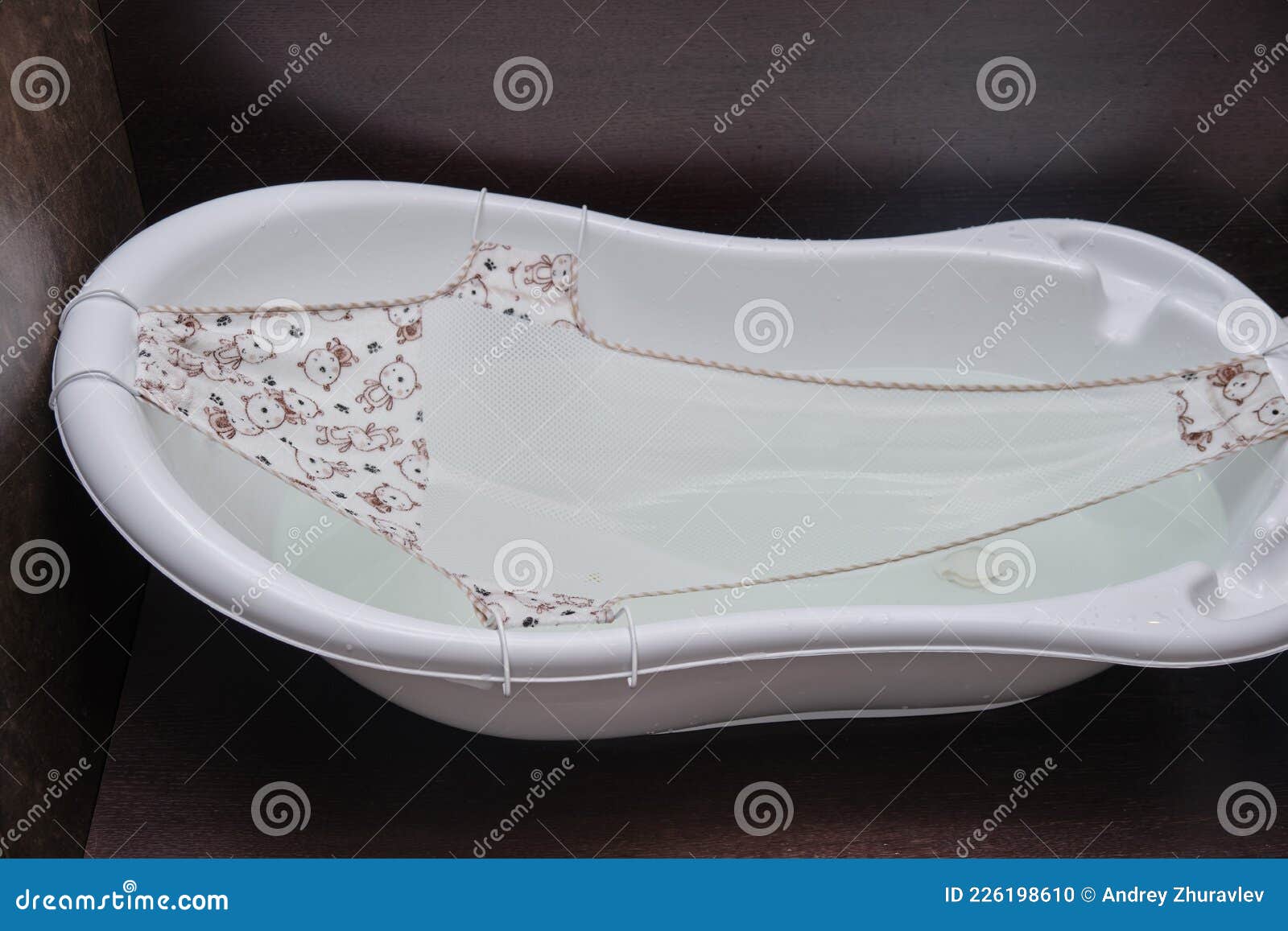 A Hammock for a Bath when Bathing Newborn Children Stock Photo Image