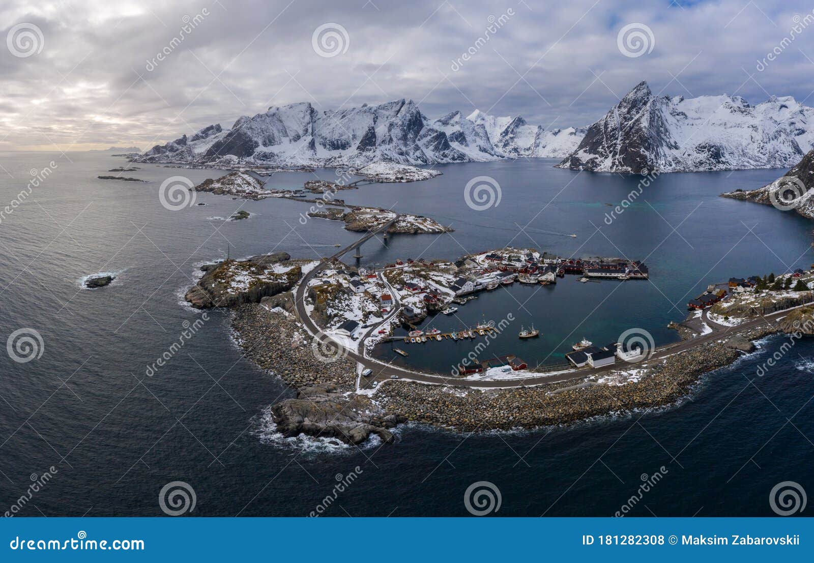 hamnoy village and mountains in winter. norwegian sea and stormy sky. moskenes, lofoten islands, norway. aerial view