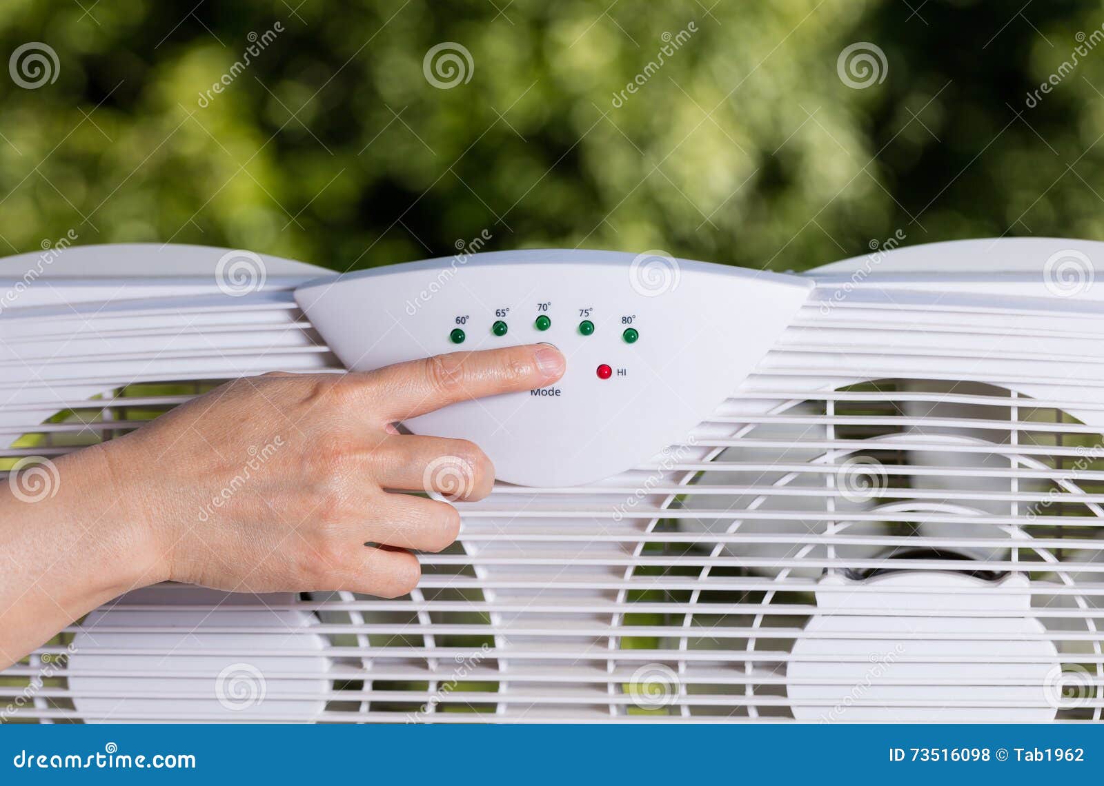 Hand Adjusting Window Fan To Cool Down Room in Home during Hot W Stock
