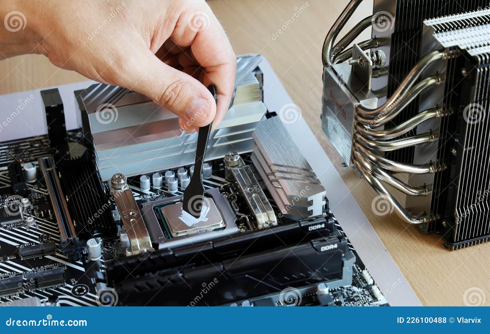 Hand Apply Thin Layer Thermal Grease To Processor for Further Compound