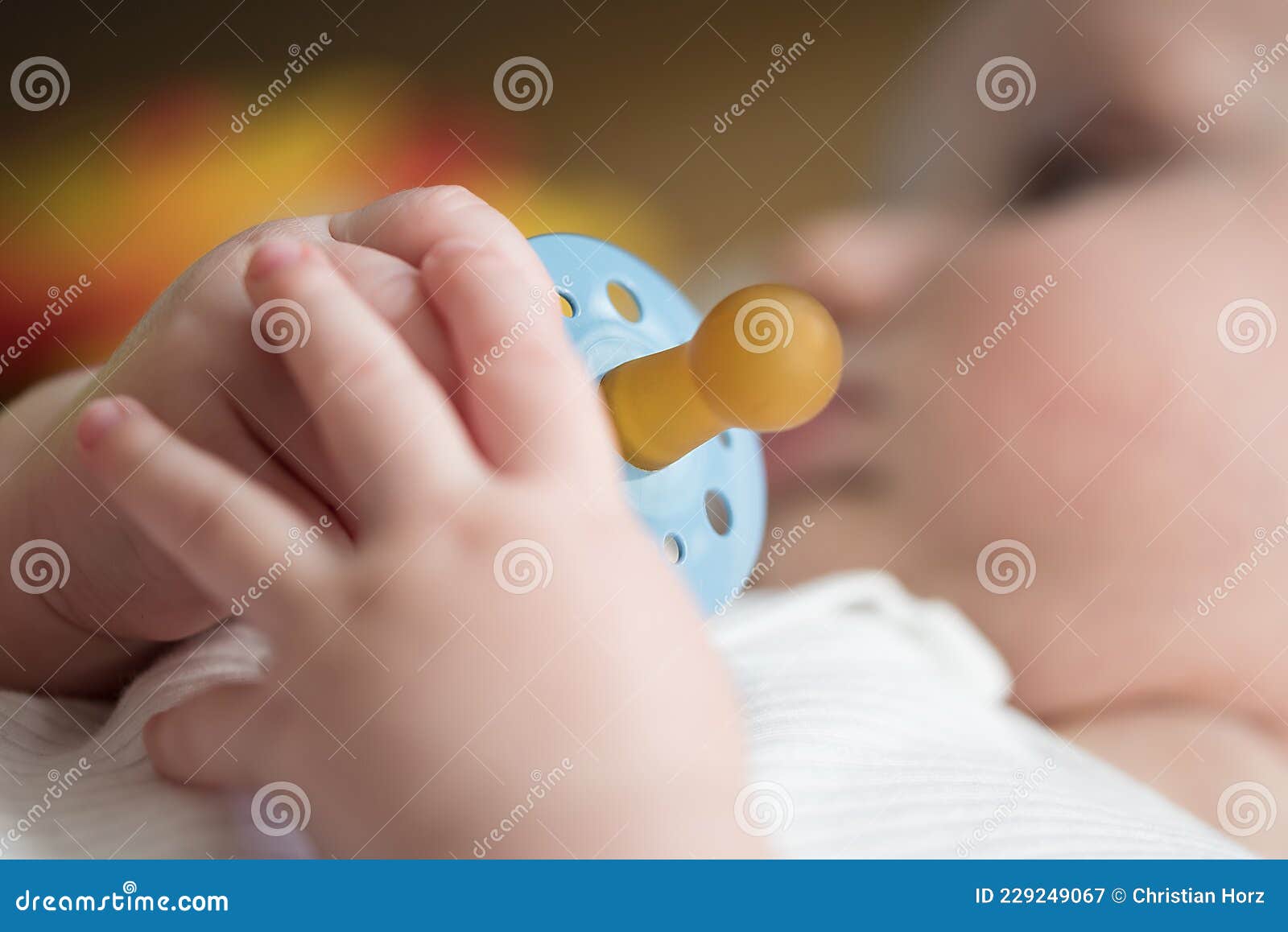 Hand of Baby Holding Pacifier Stock Image Image of calm, soother