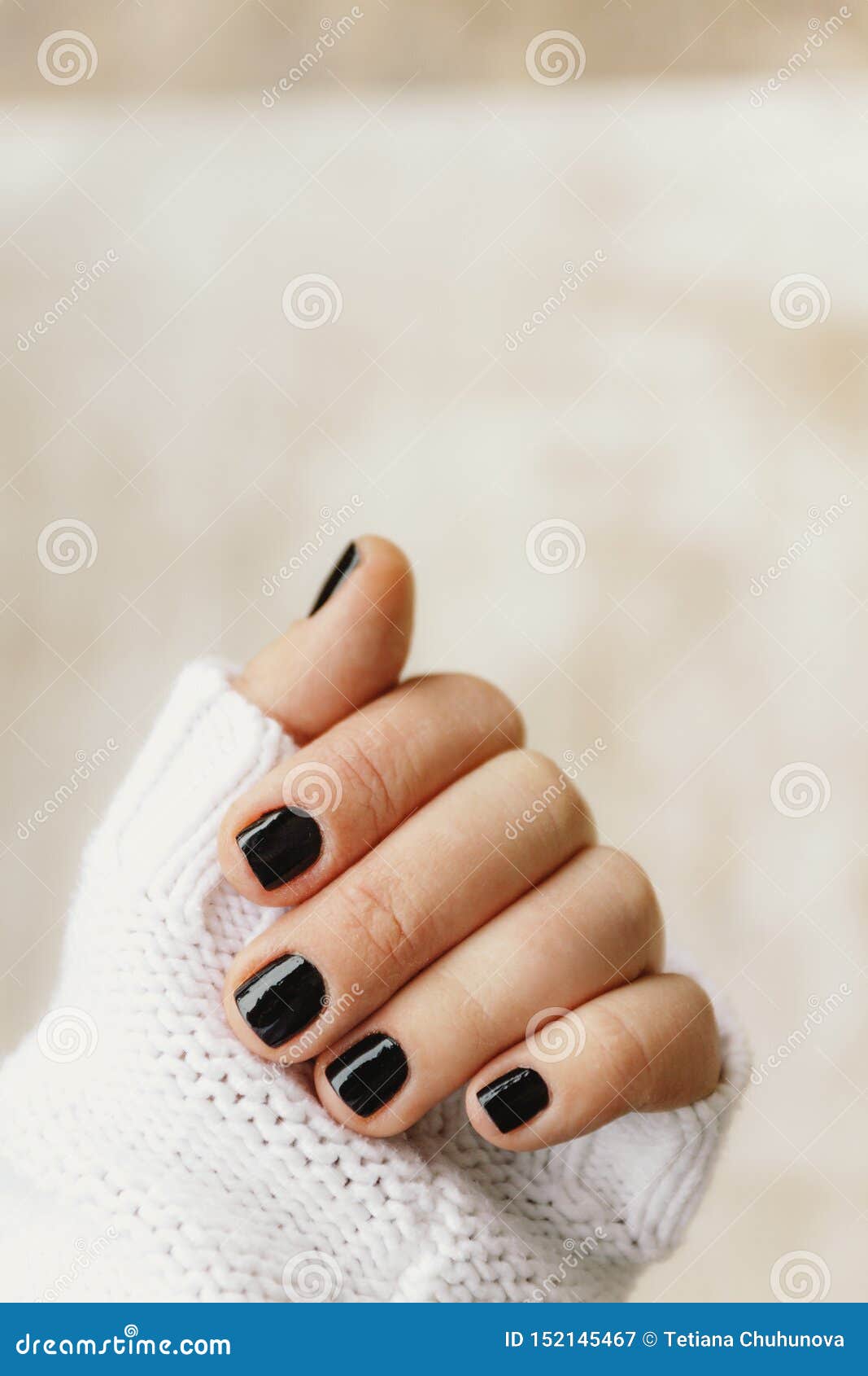 Hand with Black Manicure on Short Nails in a White Sweater on a Light  Background. the Concept of a Stylish and Warm Winter Stock Image - Image of  isolated, decals: 152145467