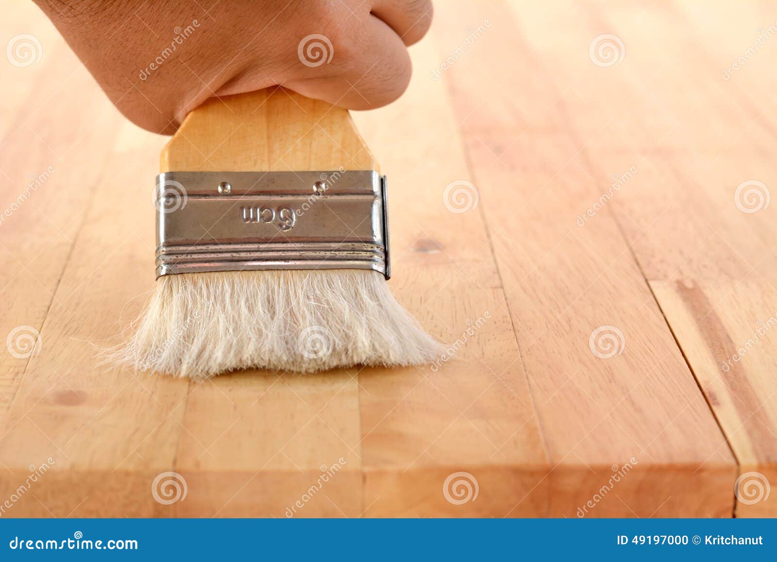 Hand with Brush on Wood Table Top Stock Photo Image of applying
