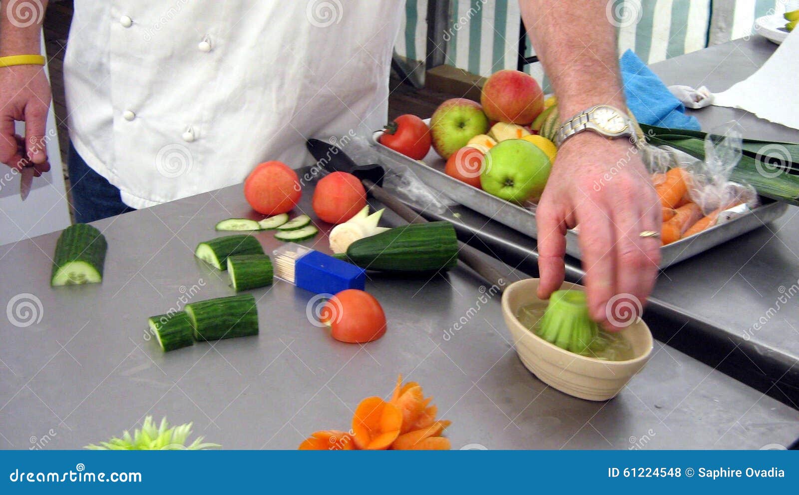 Hand of a chef at work. Closeup to a hand of chef at work