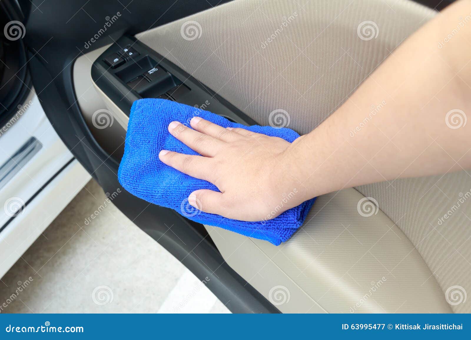 Hand Cleaning Interior Car Door Panel with Microfiber Cloth Stock Image