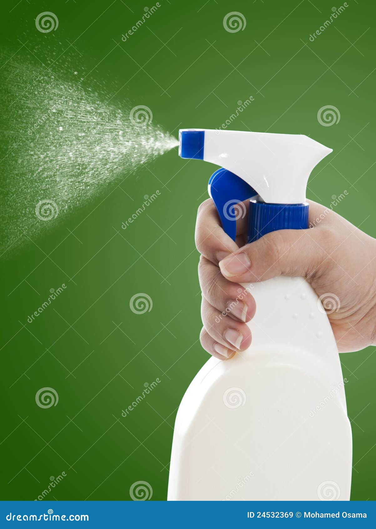 hand with cleaning spray bottle