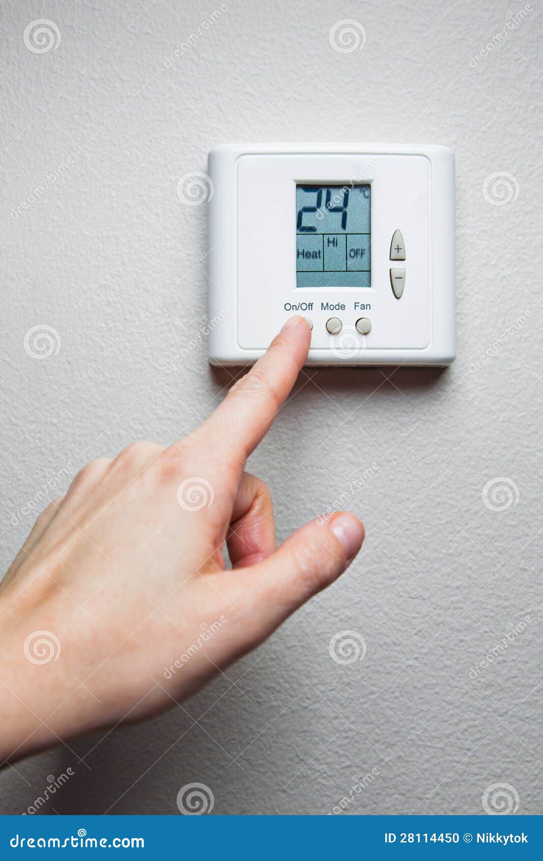 Hand On Car Climate Controls With View Of Steering And Dashboard Stock