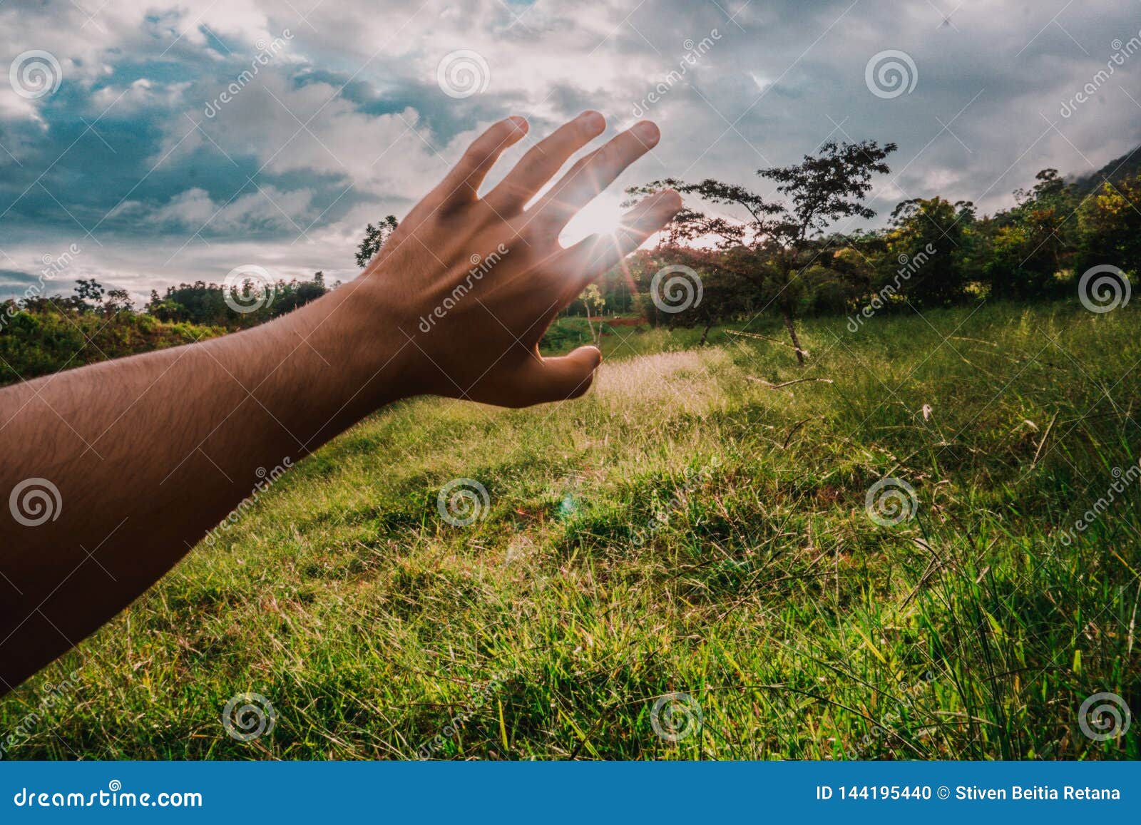 hand covering sunbeam in the hill