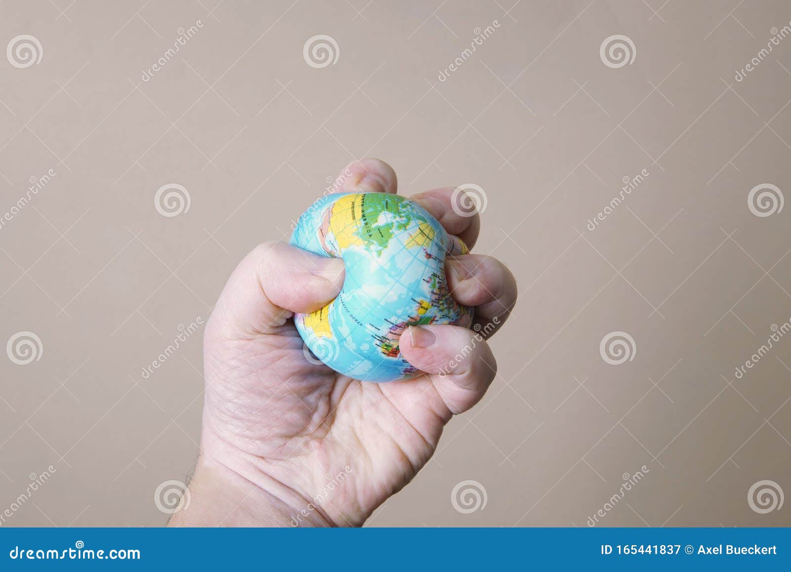 Hand Crushing Globe Of Earth Ecocide Or Destruction Of