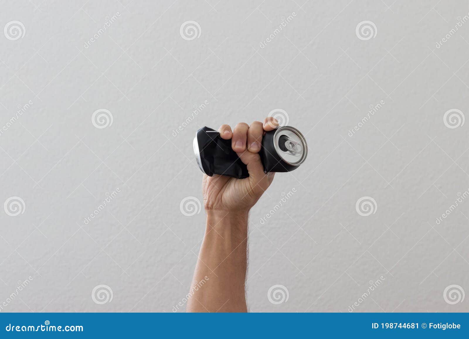 Hand Crushing Used Can Representing Movement Against Pollution and for