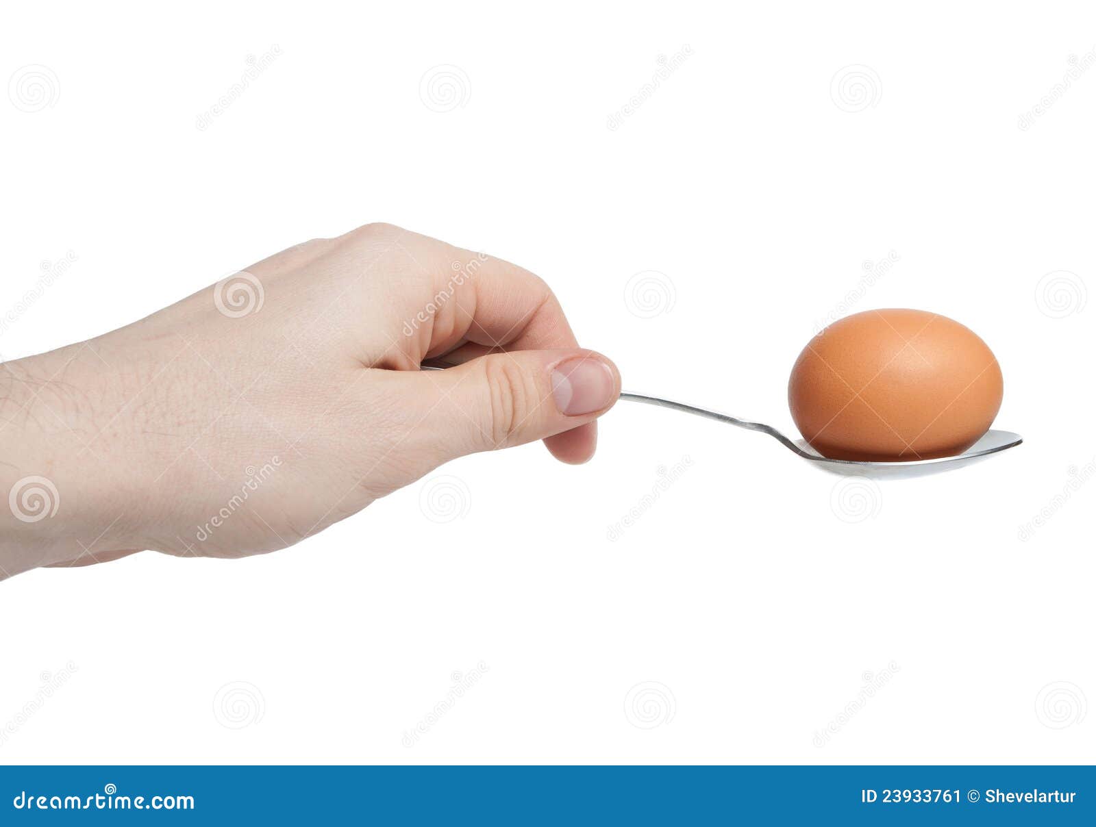 hand with egg on spoon