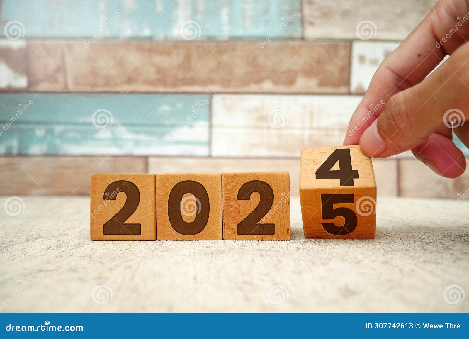 Countdown To 2025. Wooden Numbers 2024 Replaced By 2025 On Green Background RoyaltyFree Stock