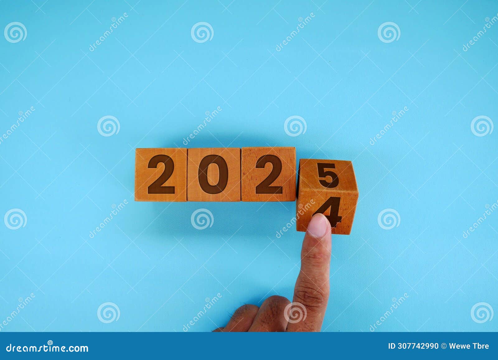 Countdown To 2025. Wooden Numbers 2024 Replaced By 2025 On Green