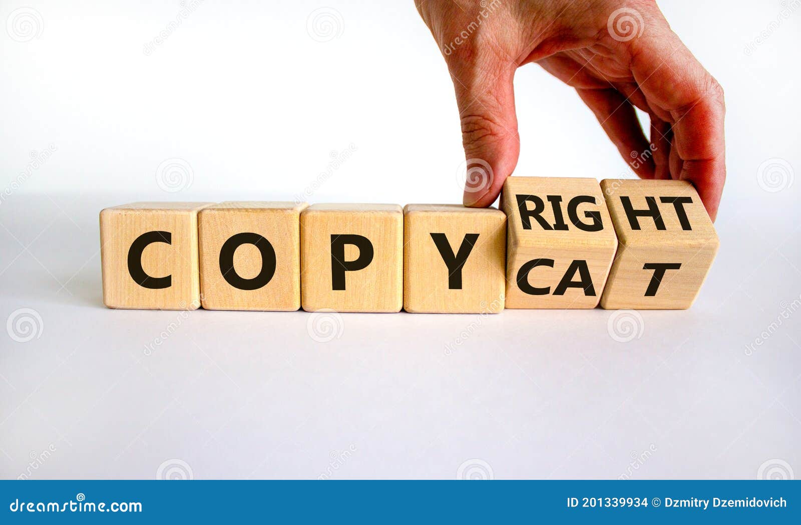 hand flips cubes and changes the word `copycat` to `copyright`. beautiful white background. business concept. copy space