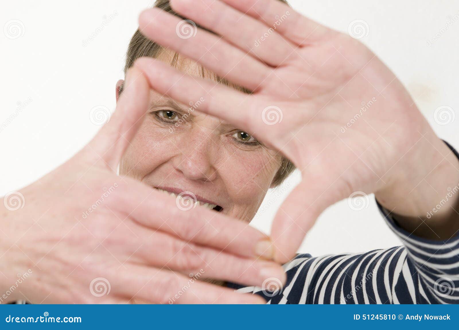 hand frame oler woman smiling