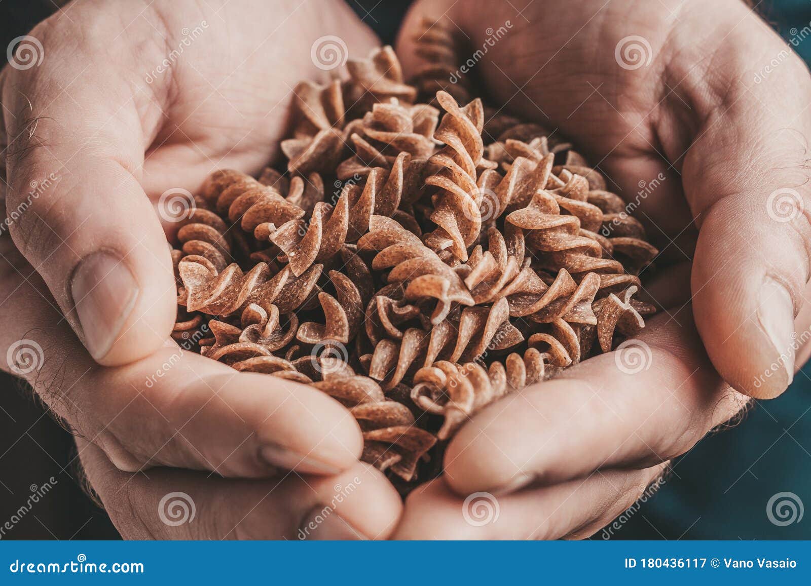 Hand with fusilli paste stock image. Image of kitchen 180436117
