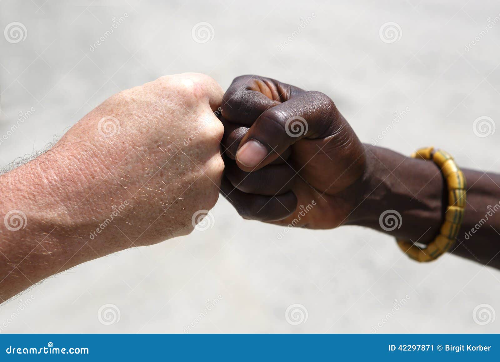 Hand Greeting Between A Caucasian And An African Stock Image - Image