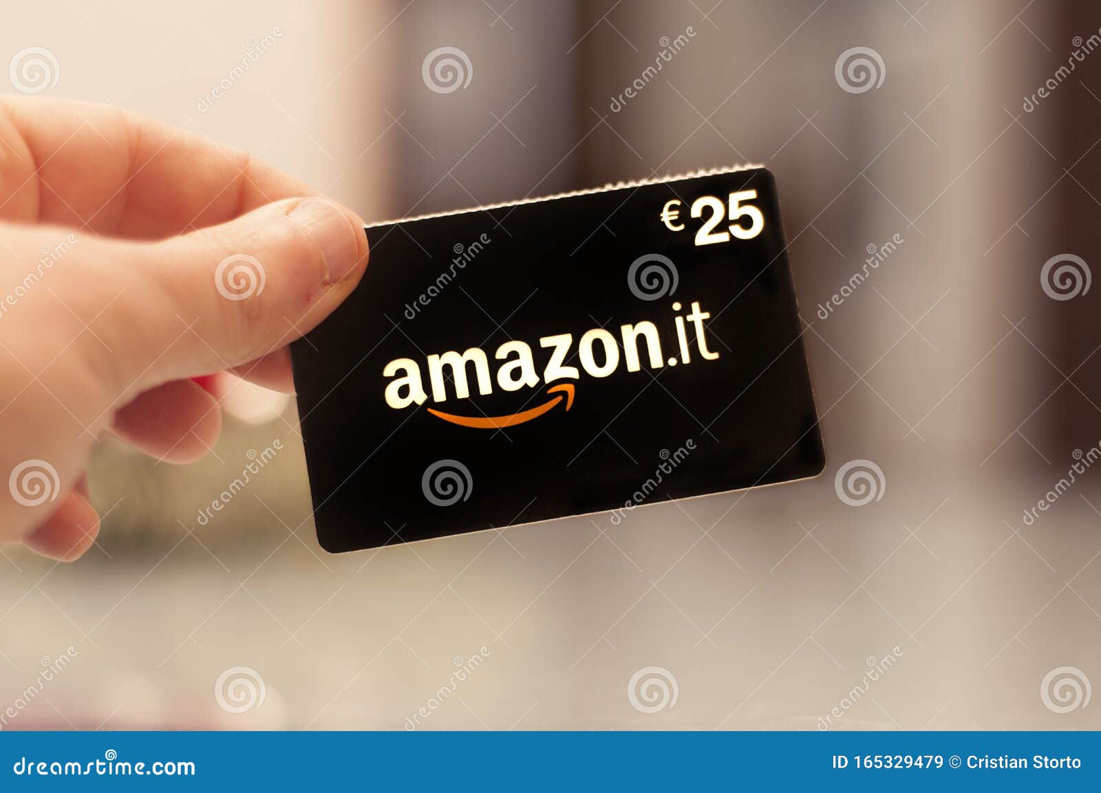 Hand Hold A 25 Euro Italian Amazon Gift Card, That Allows Customers To Do Shopping On The Amazon ...