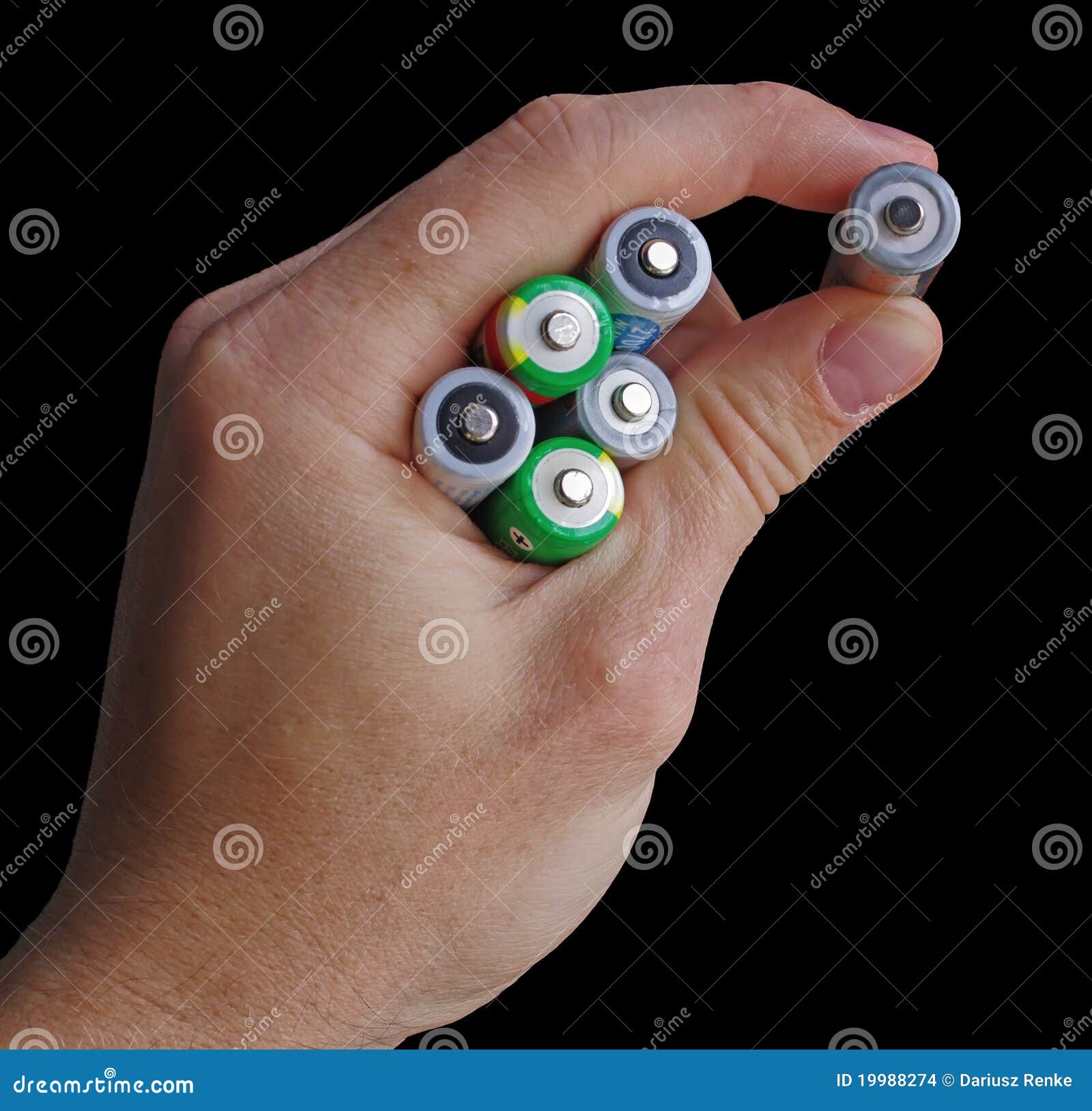 Hand Holding an AA Batteries Isolated on Black Stock Photo Image of