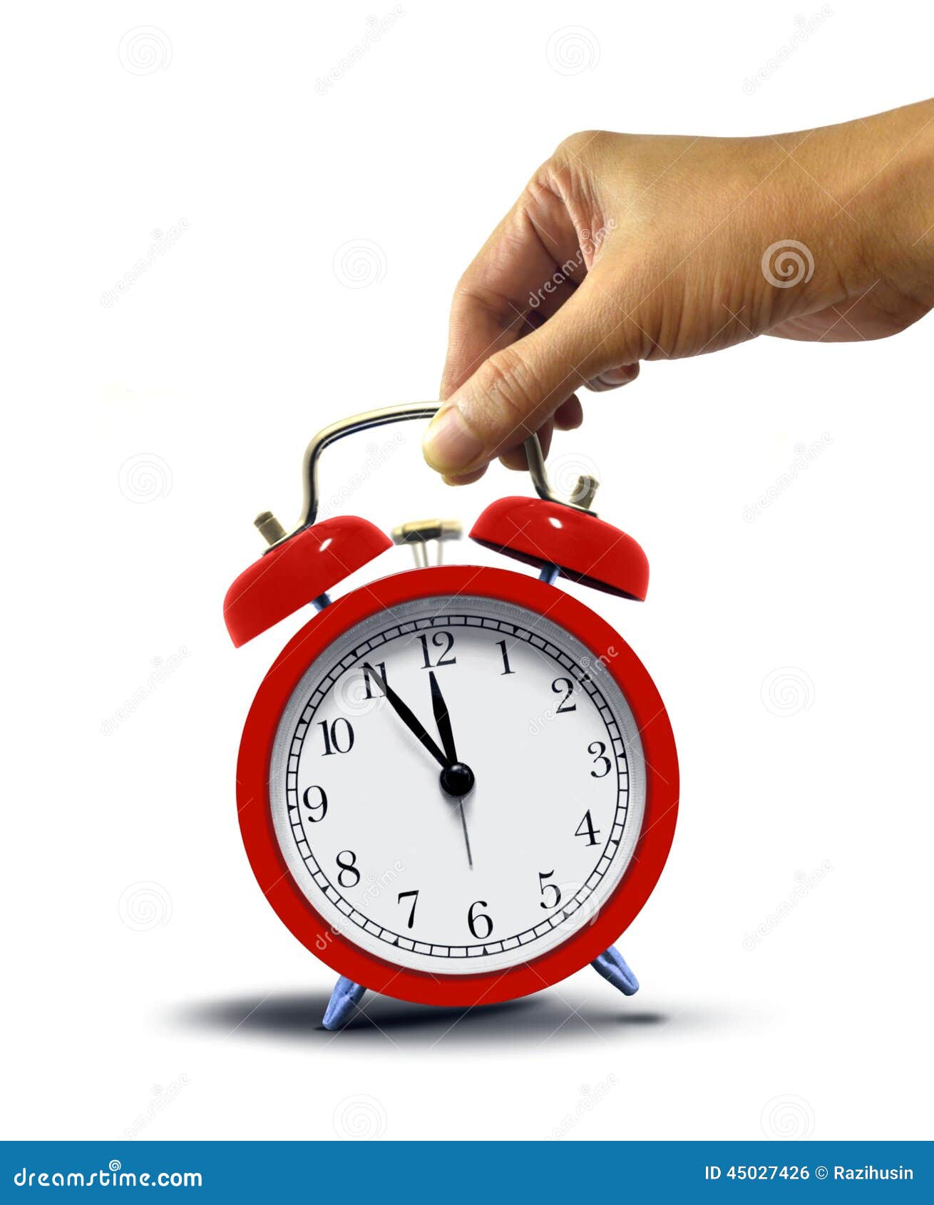 Hand Holding Alarm Clock stock photo. Image of background 45027426