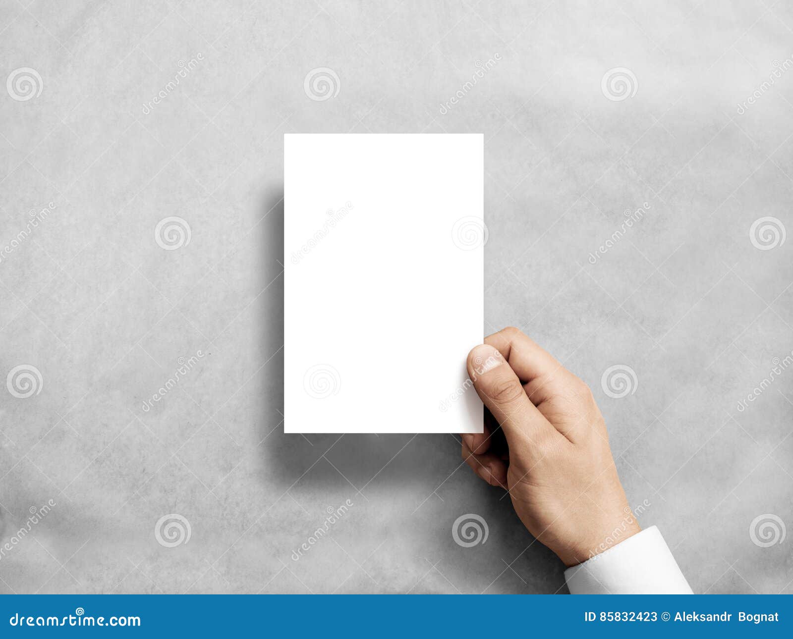 hand holding blank white vertical postcard flyer mockup.