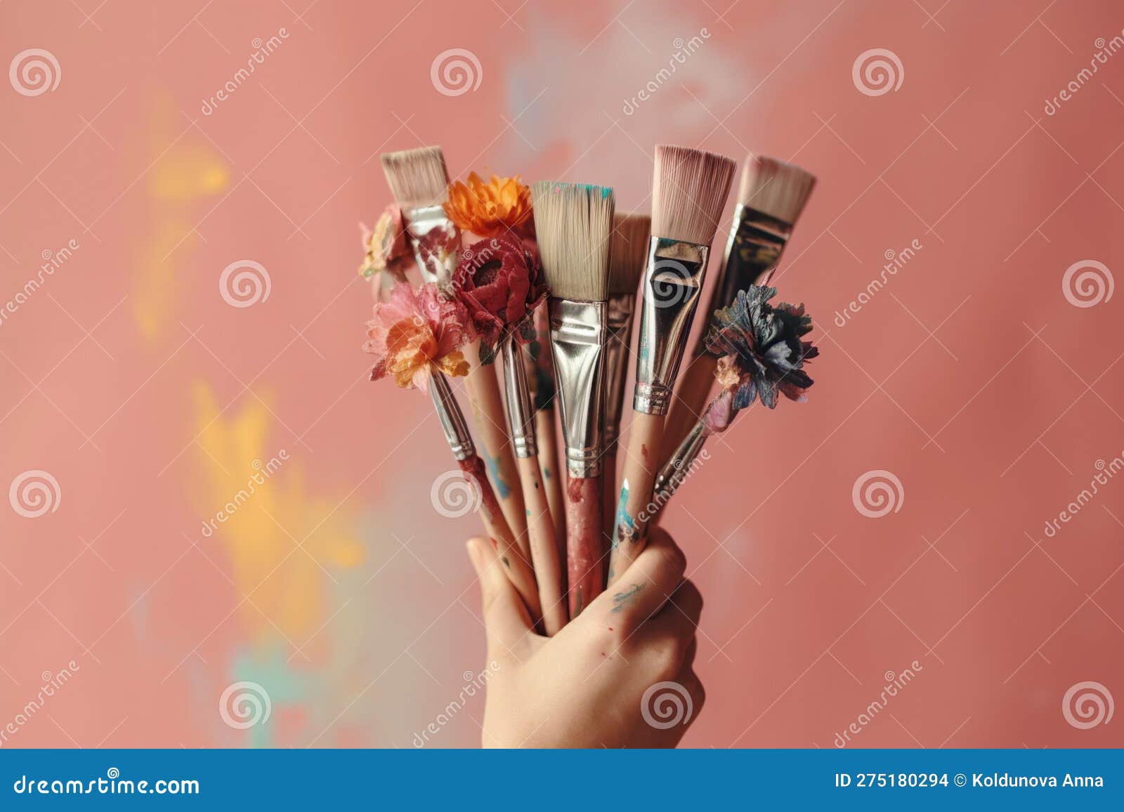 Hand Holding a Bouquet of Paint Brushes and Rollers Created with