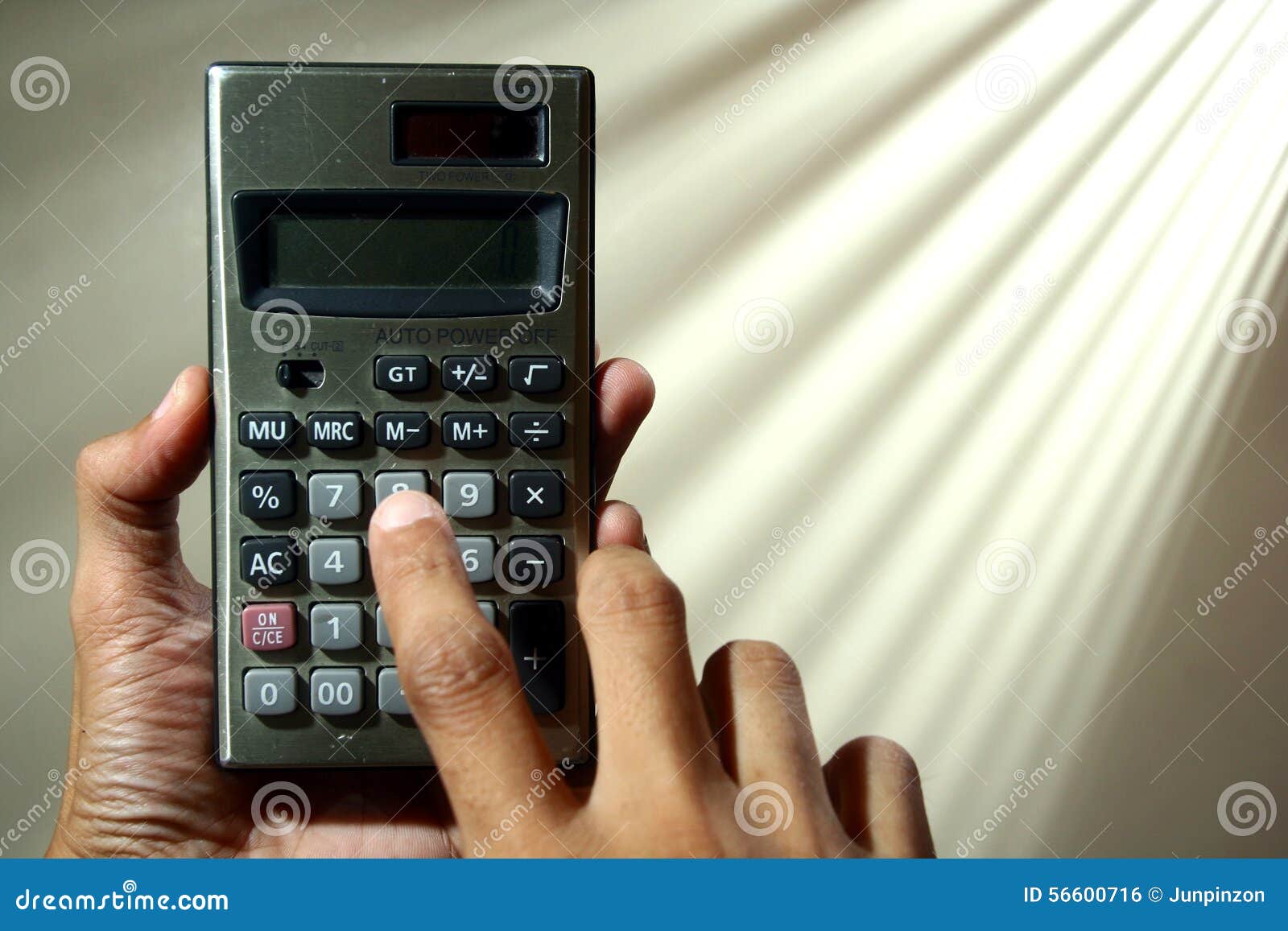 Hand holding a calculator stock photo. Image of expense 56600716