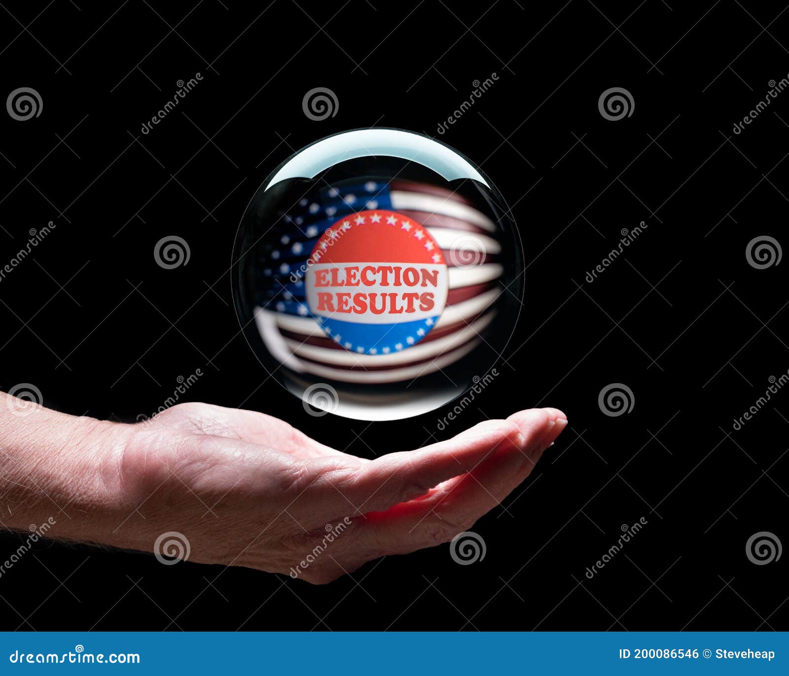 hand holding a crystal glass forecasting ball to predict the result of the election