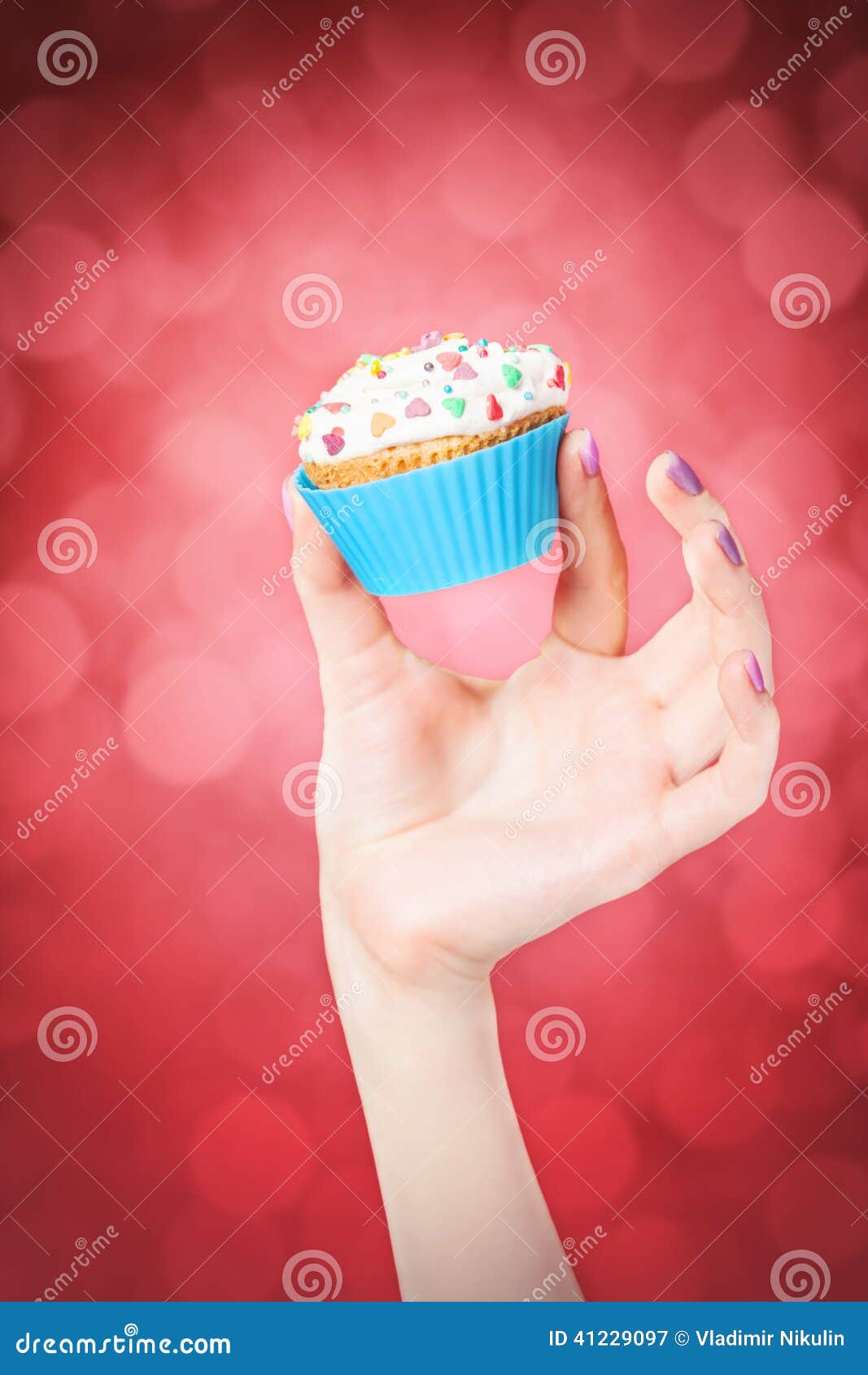 Hand holding cupcake stock image. Image of gastronomy 41229097