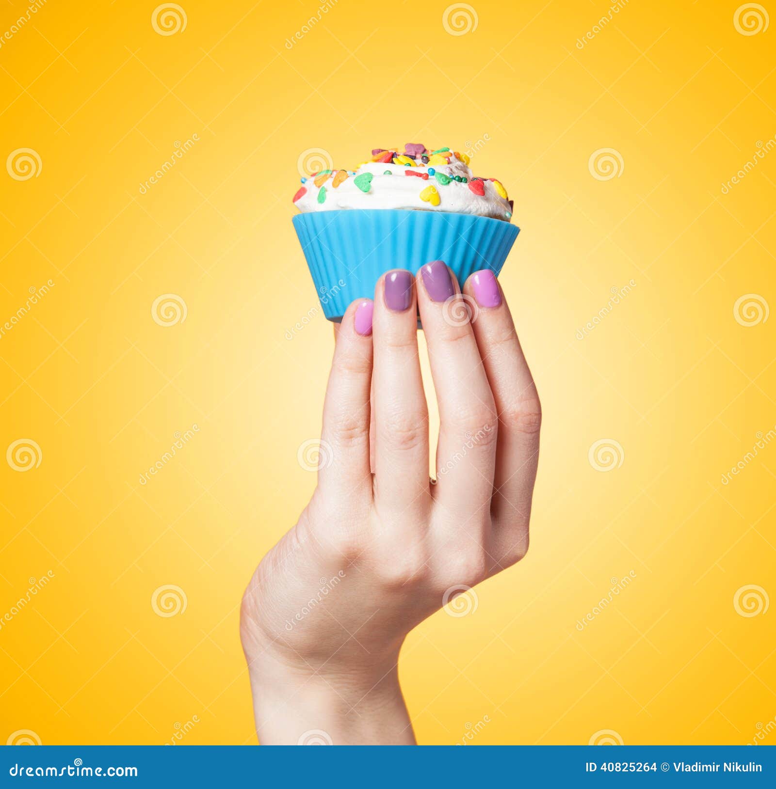 Hand holding cupcake stock photo. Image of delicious 40825264