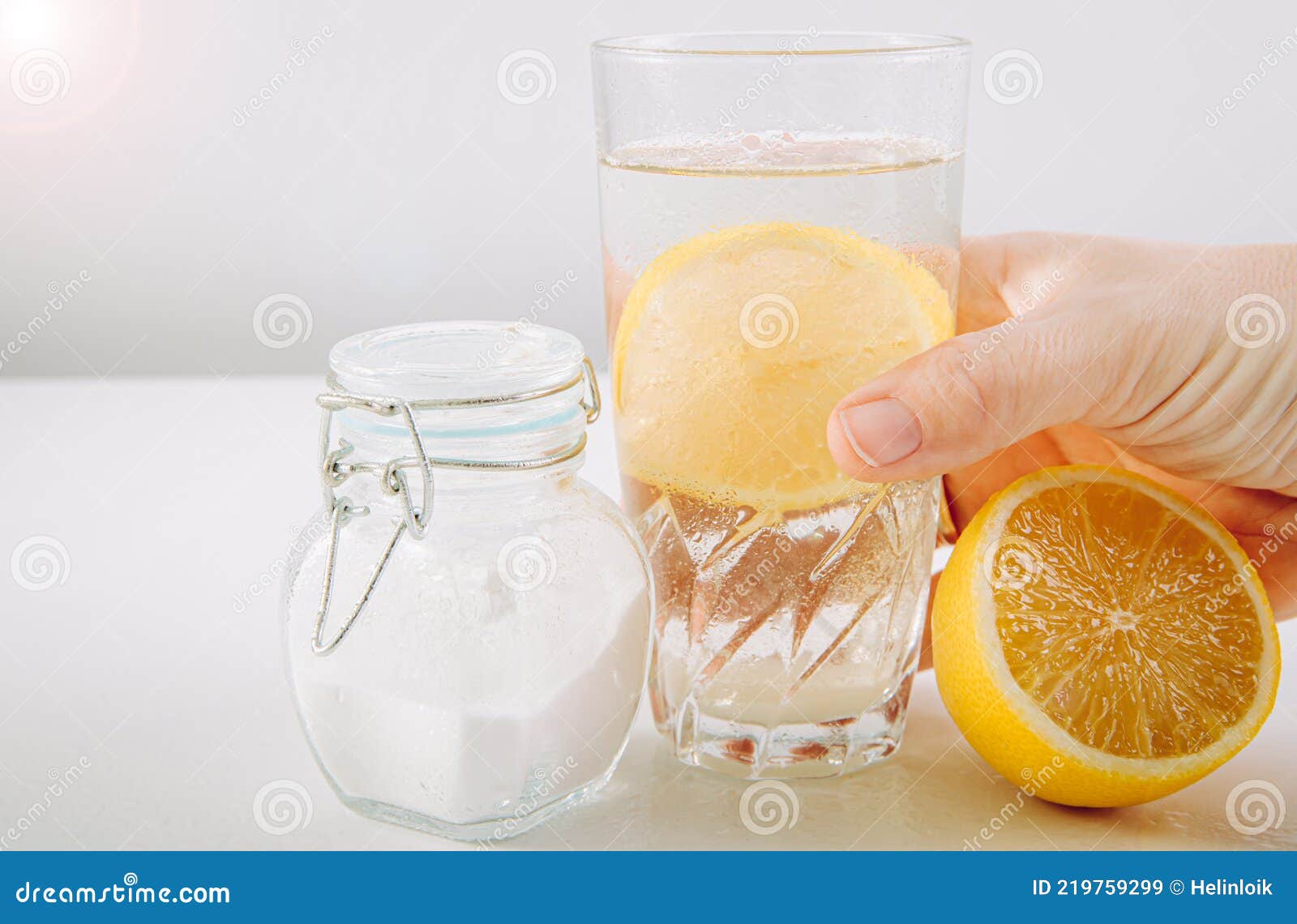 Hand Holding Drinking Glass With Baking Soda, Water And Lemon Juice Infusion, Health Benefits For Digestive System Concept Stock Image - Image Of Homemade, Benefits: 219759299