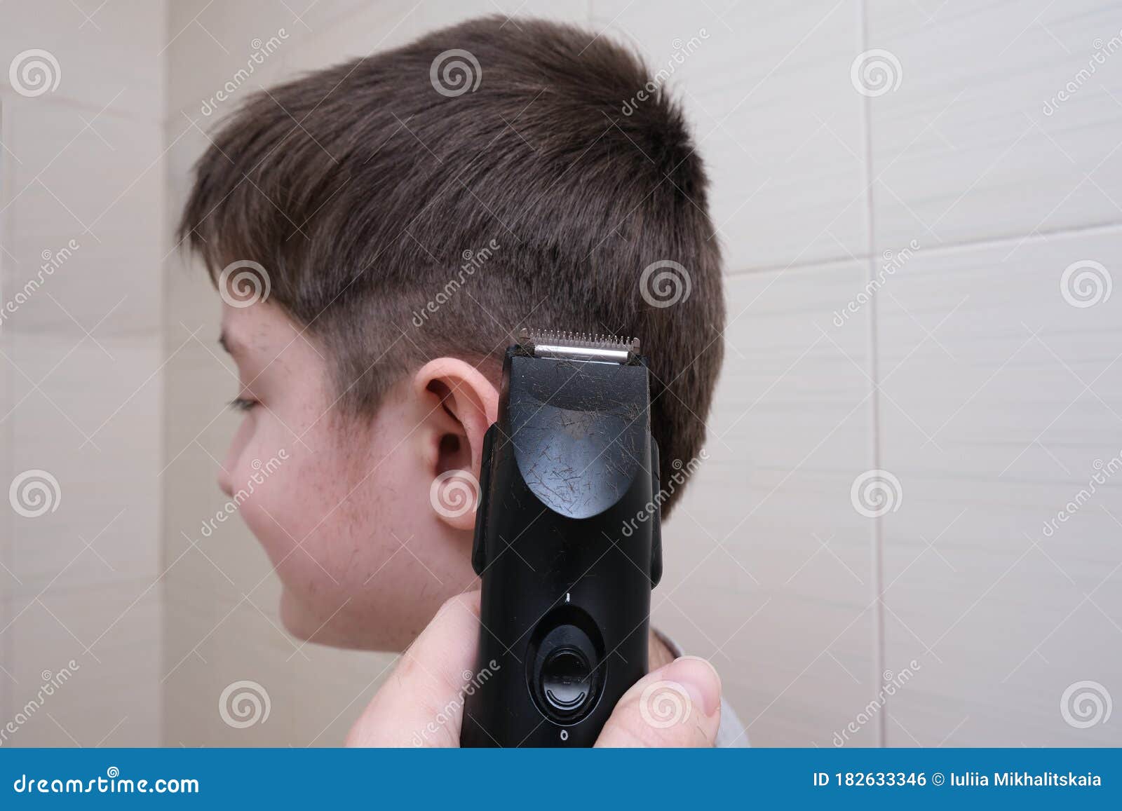 A Hand Holding Electric Hair Clipper and Going To Make a Boy Haircut at Home in the Bathroom, Homemade Hairstyle Stock Photo - Image of hairdressing, mother: 182633346 A Hand Holding Electric Hair Clipper and Going To Make a Boy Haircut at Home in the Bathroom, Homemade Hairstyle Stock Photo - Image of hairdressing, mother: 182633346