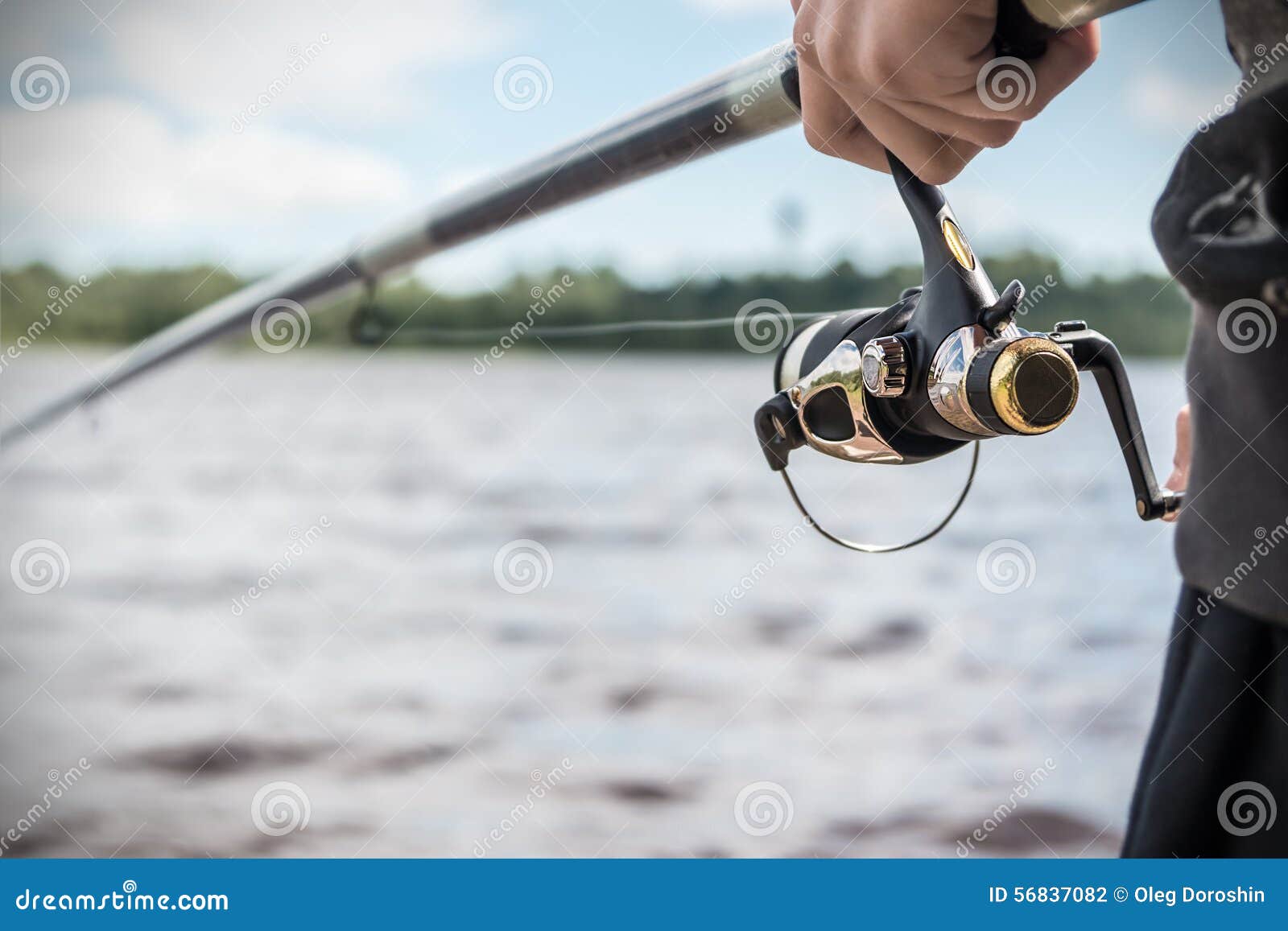 Hand Holding a Fishing Rod with Reel Stock Photo - Image of object