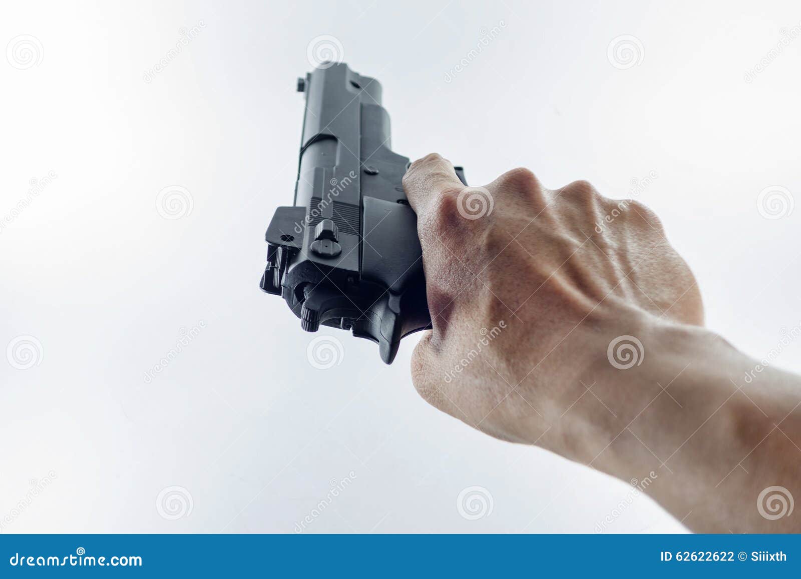 Hand holding a handgun stock photo. Image of finger, holding 62622622