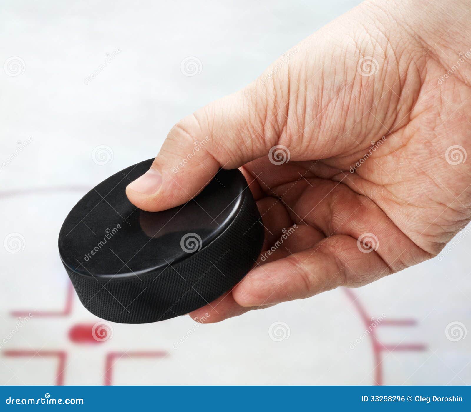 Hand Holding a Hockey Puck on Ice Stock Photo Image of hand, object