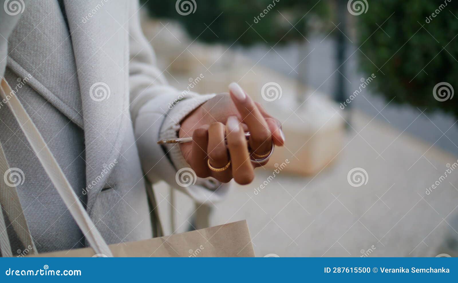 hand holding house keys outside closeup. real estate agent waiting rent client