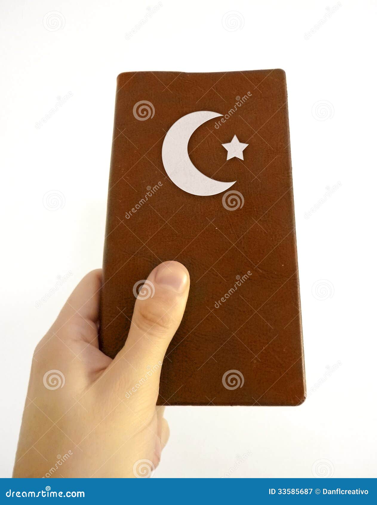 hand holding islamic book