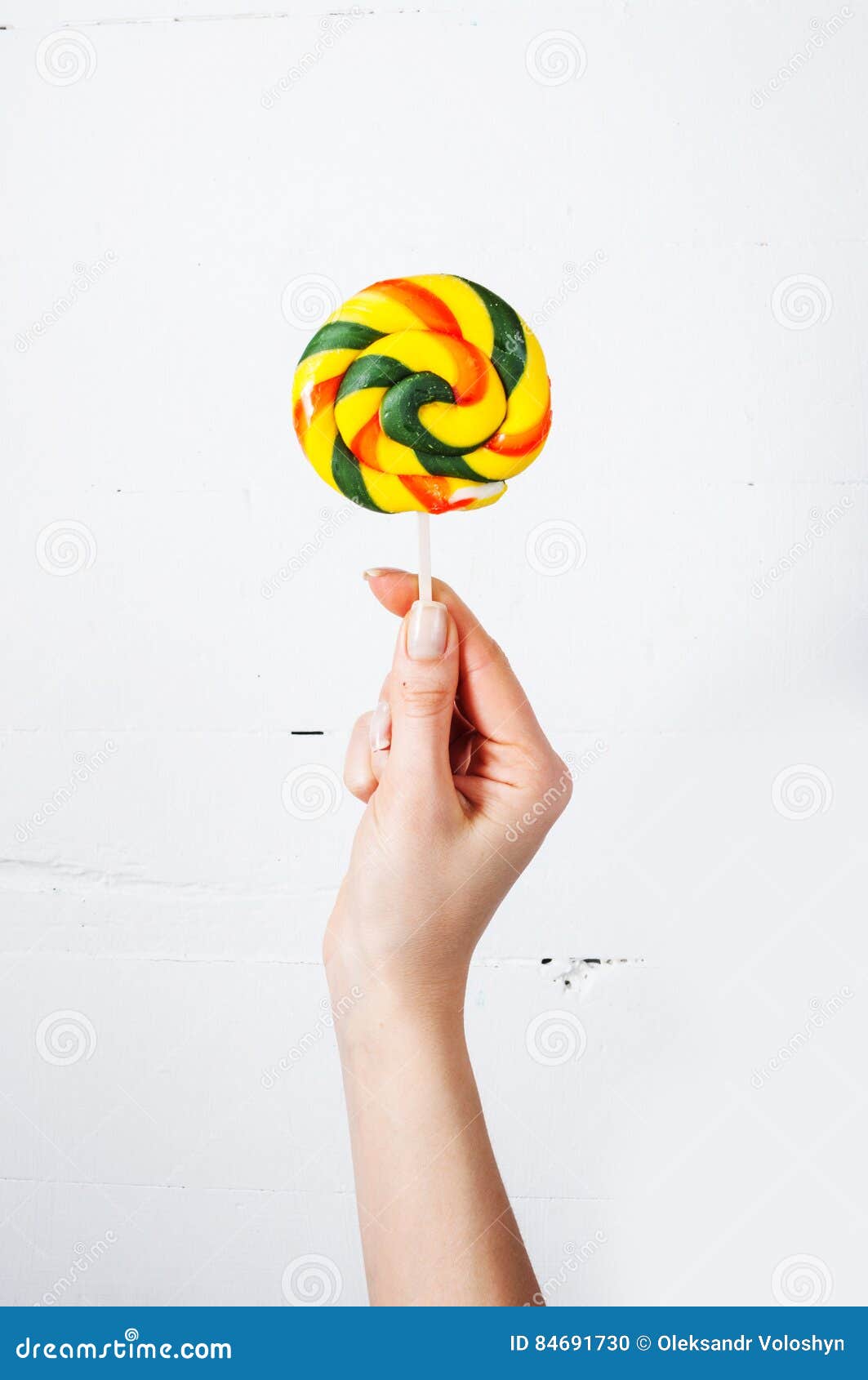 Hand Holding Lollipop Isolated on White Wood Background Stock Photo ...