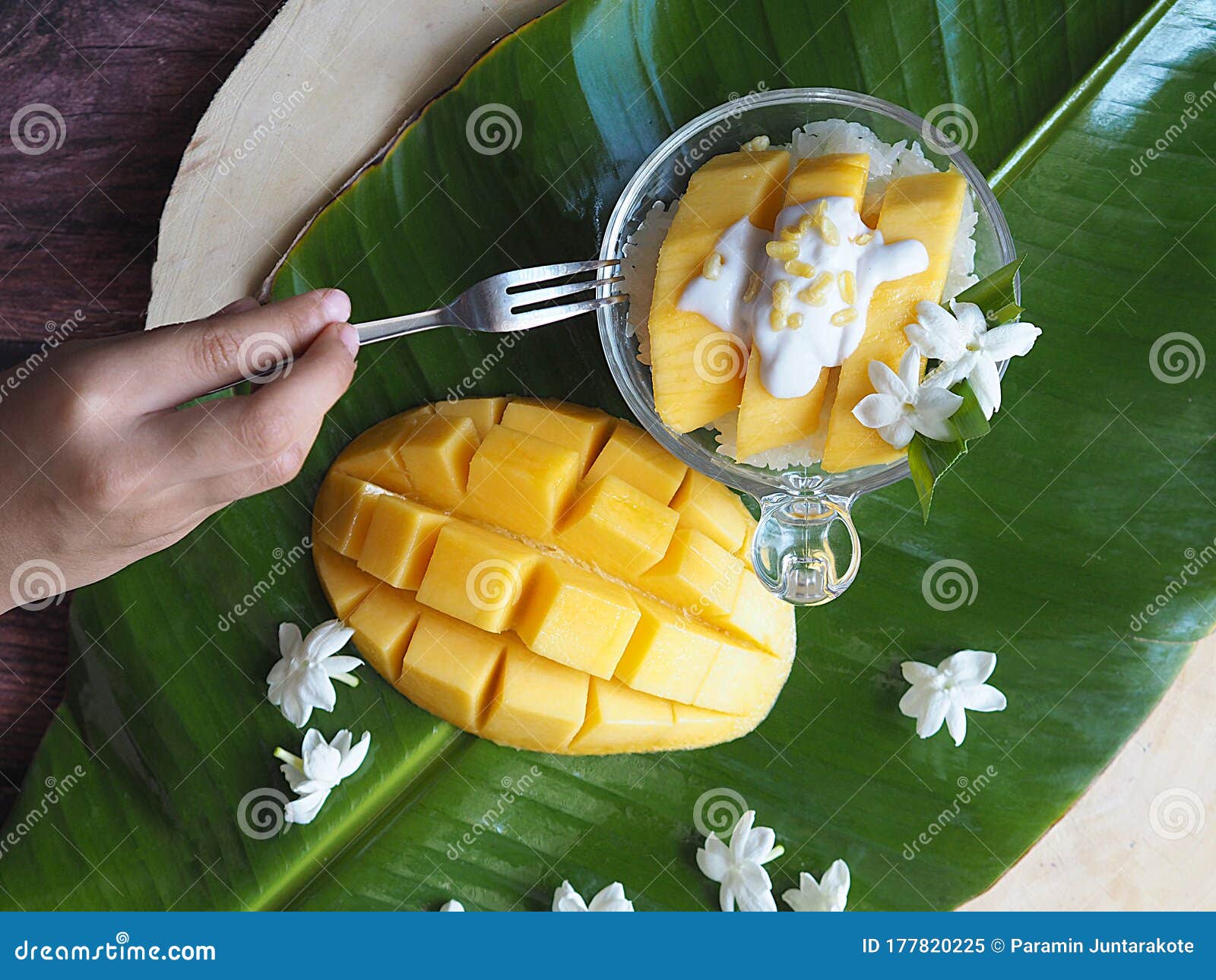 Hand Holding of Mango Sticky Rice by a Fork Isolated in Banana Leaf ...