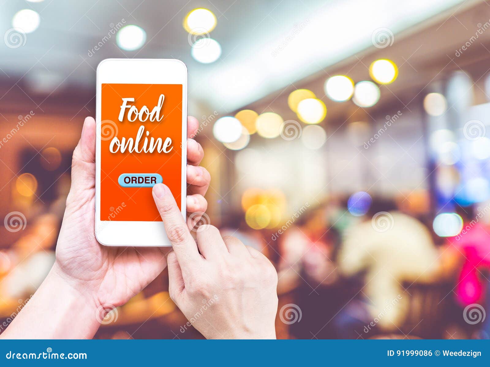 hand holding mobile with order food online with blur restaurant