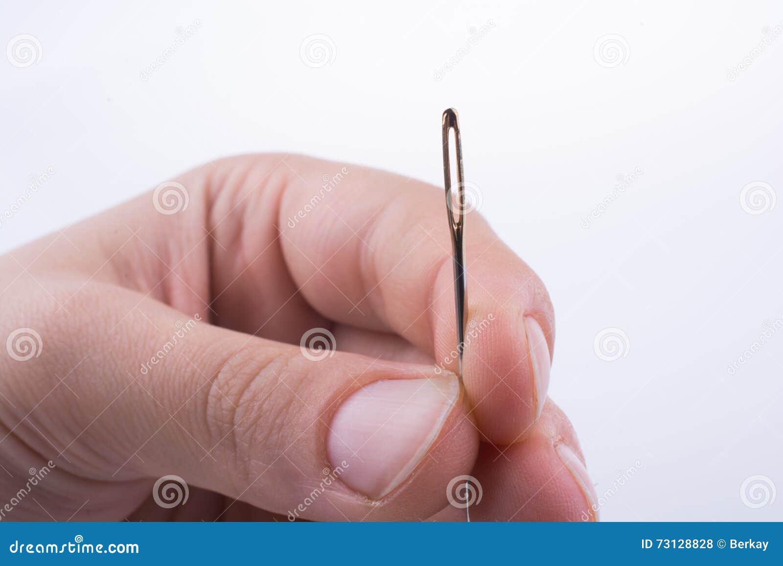 Hand holding a needle stock photo. Image of thread, tool 73128828