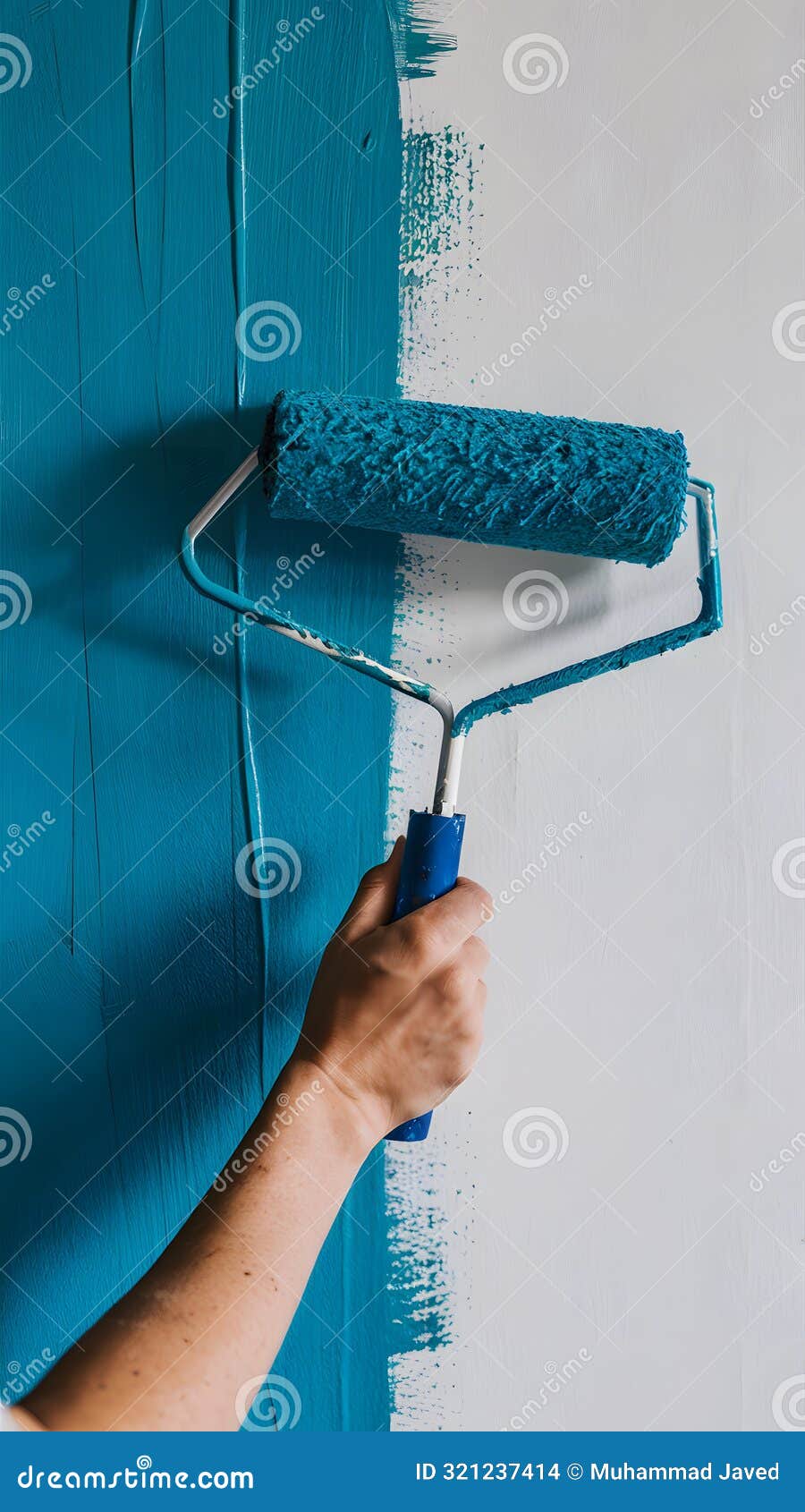 Paint Roller Gripping Hand, Gliding Over White Wall, Leaving Textured