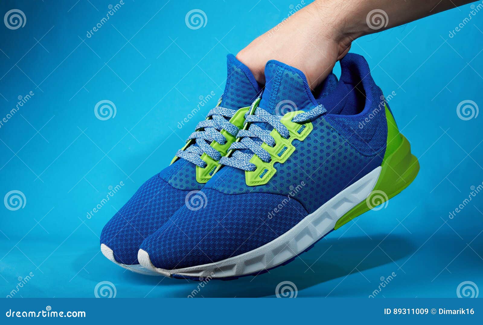 Hand Holding Pair of New Running Shoes Stock Image - Image of concept ...